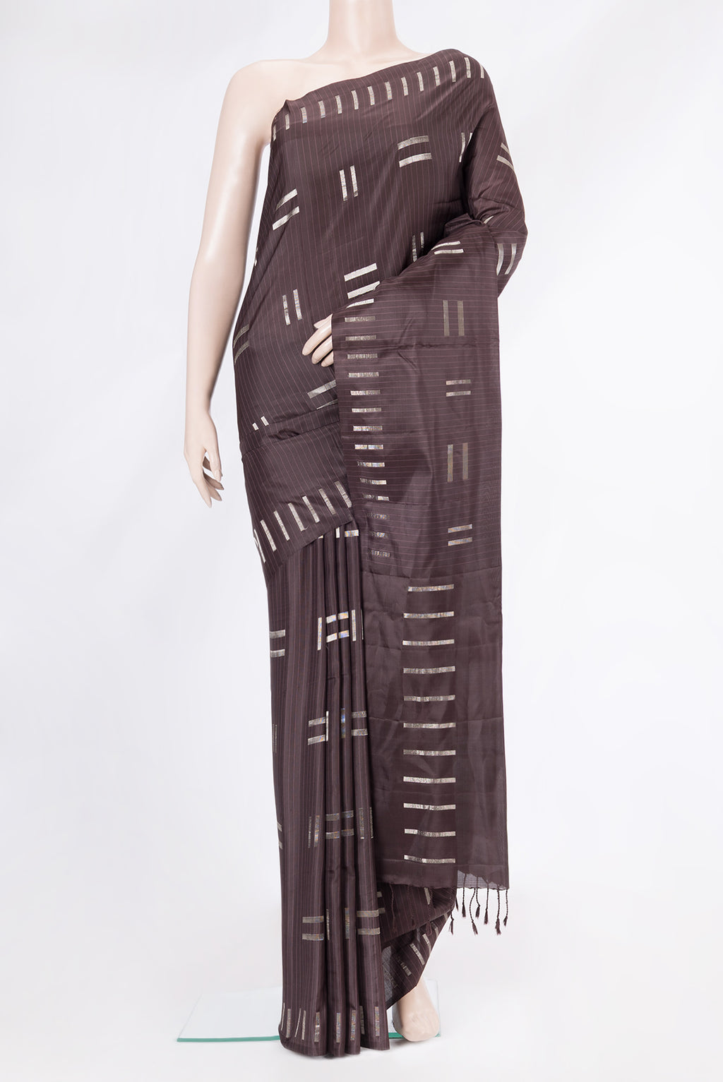 Coffee Brown Soft Silk Saree with Zari Butta on the body and Without Border.  displayed on a mannequin