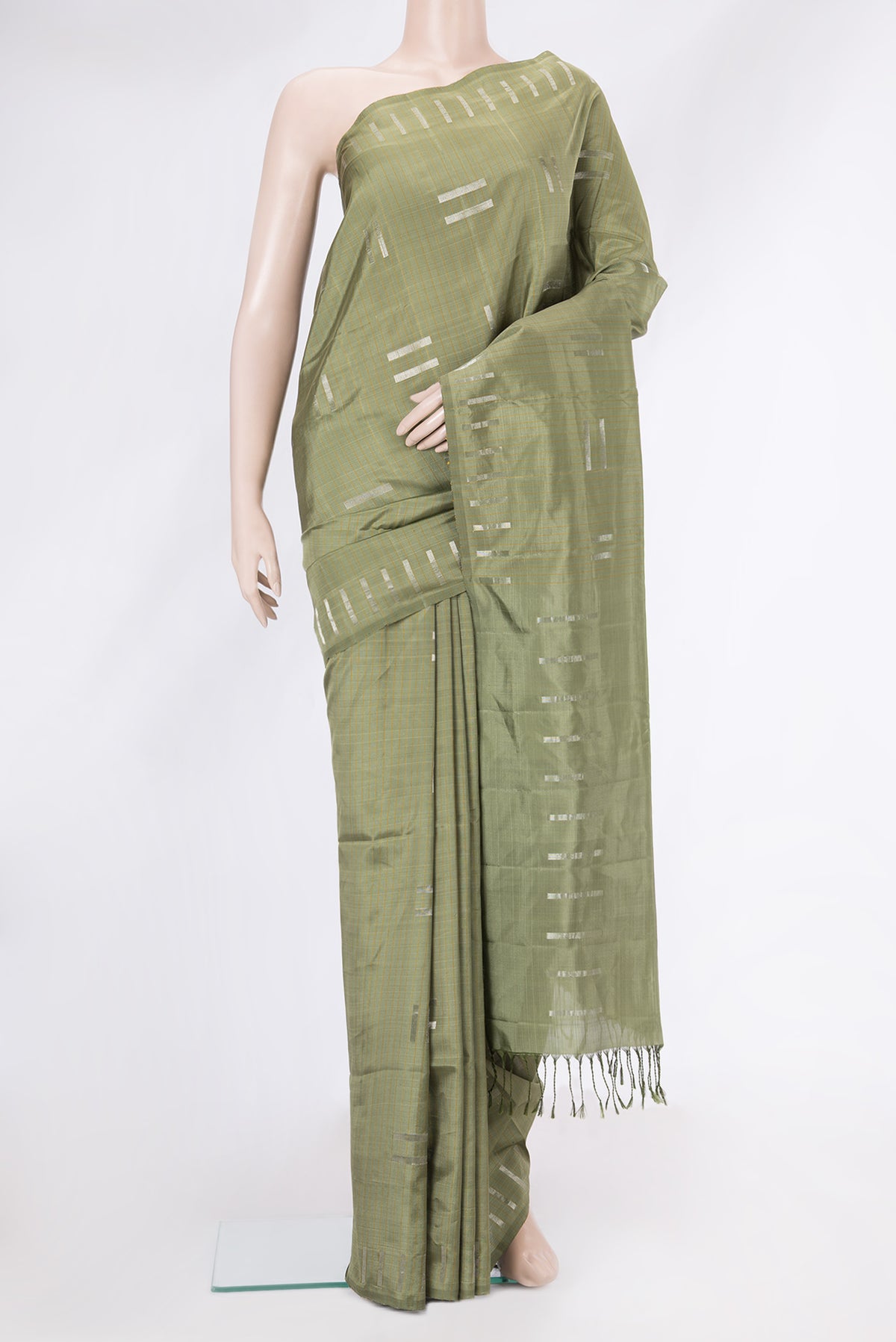 Pista Green Dual Tone Soft Silk Saree with Zari Butta on the body and Zari Border.  displayed on a mannequin