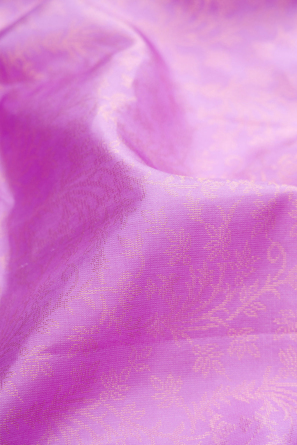 Close up of Lavender Dual Tone Soft Silk Saree with Zari Brocade on the body and Zari Border.  displaying folds