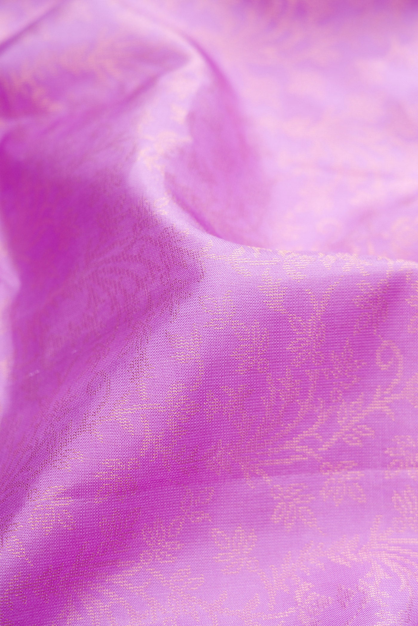 Close up of Lavender Dual Tone Soft Silk Saree with Zari Brocade on the body and Zari Border.  displaying folds