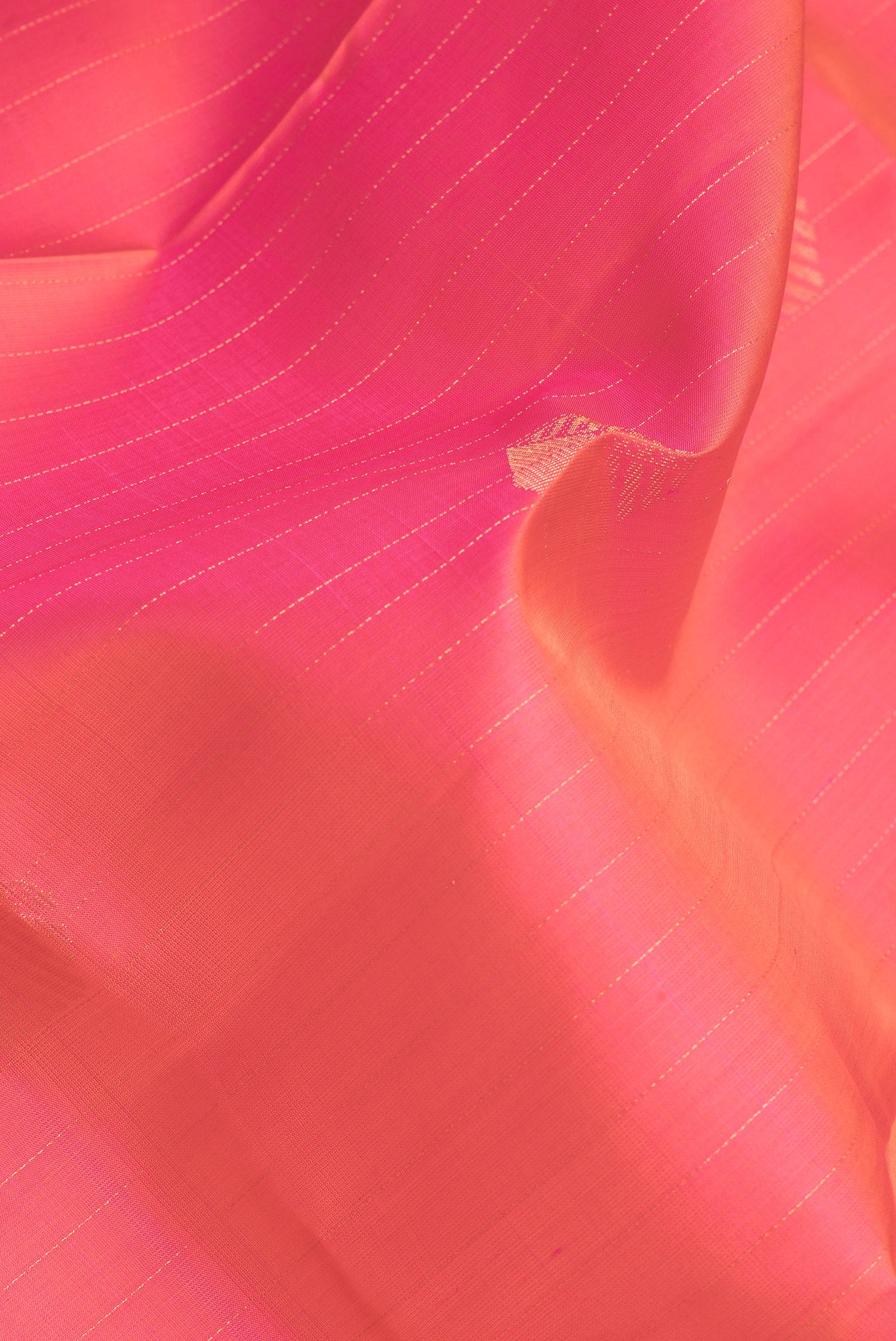 Close up of Pink Dual Tone Soft Silk Saree with Stripes on the body and Without Border.  displaying folds