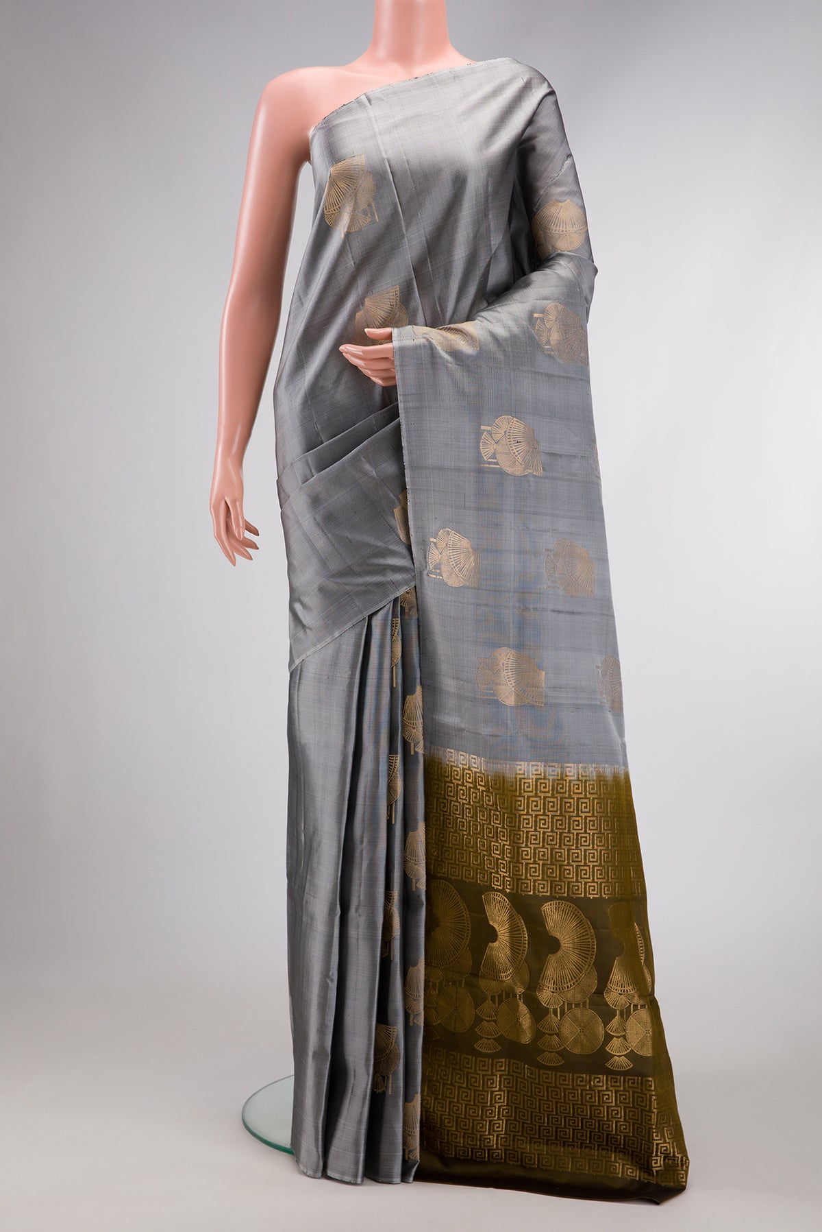 Grey Dual Tone Soft Silk Saree with Zari Butta on the body and Without Border.  displayed on a mannequin