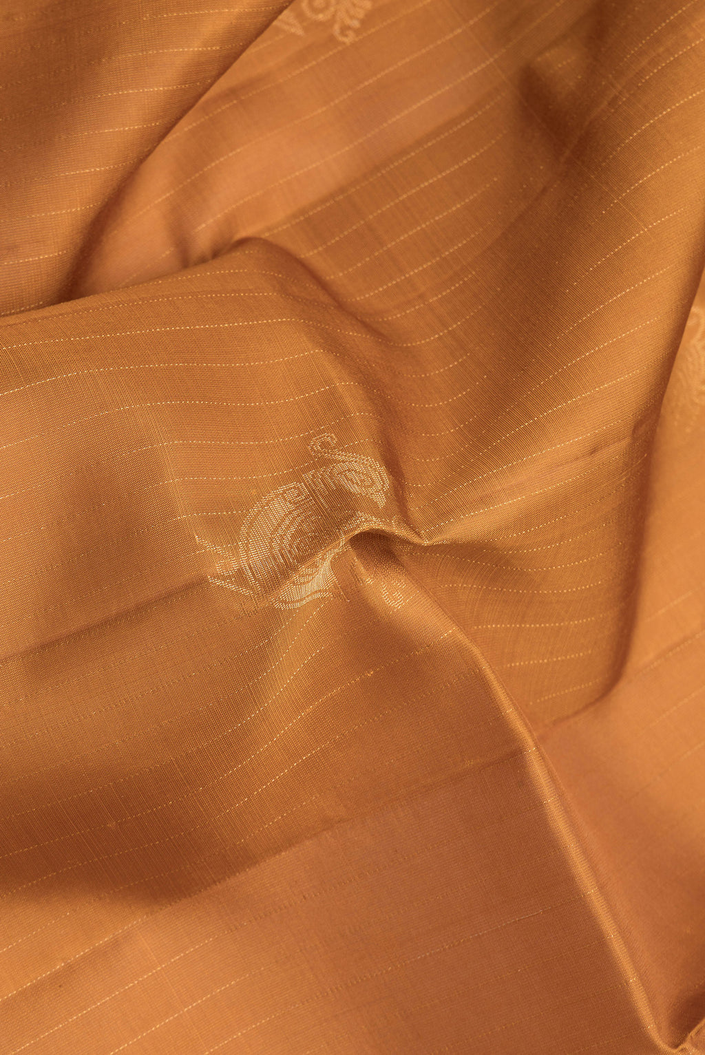 Close up of Mustard Soft Silk Saree with Stripes on the body and Without Border.  displaying folds