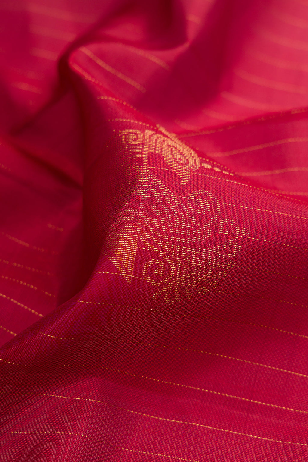 Close up of Maroon Dual Tone Soft Silk Saree with Zari Butta on the body and Without Border.  displaying folds