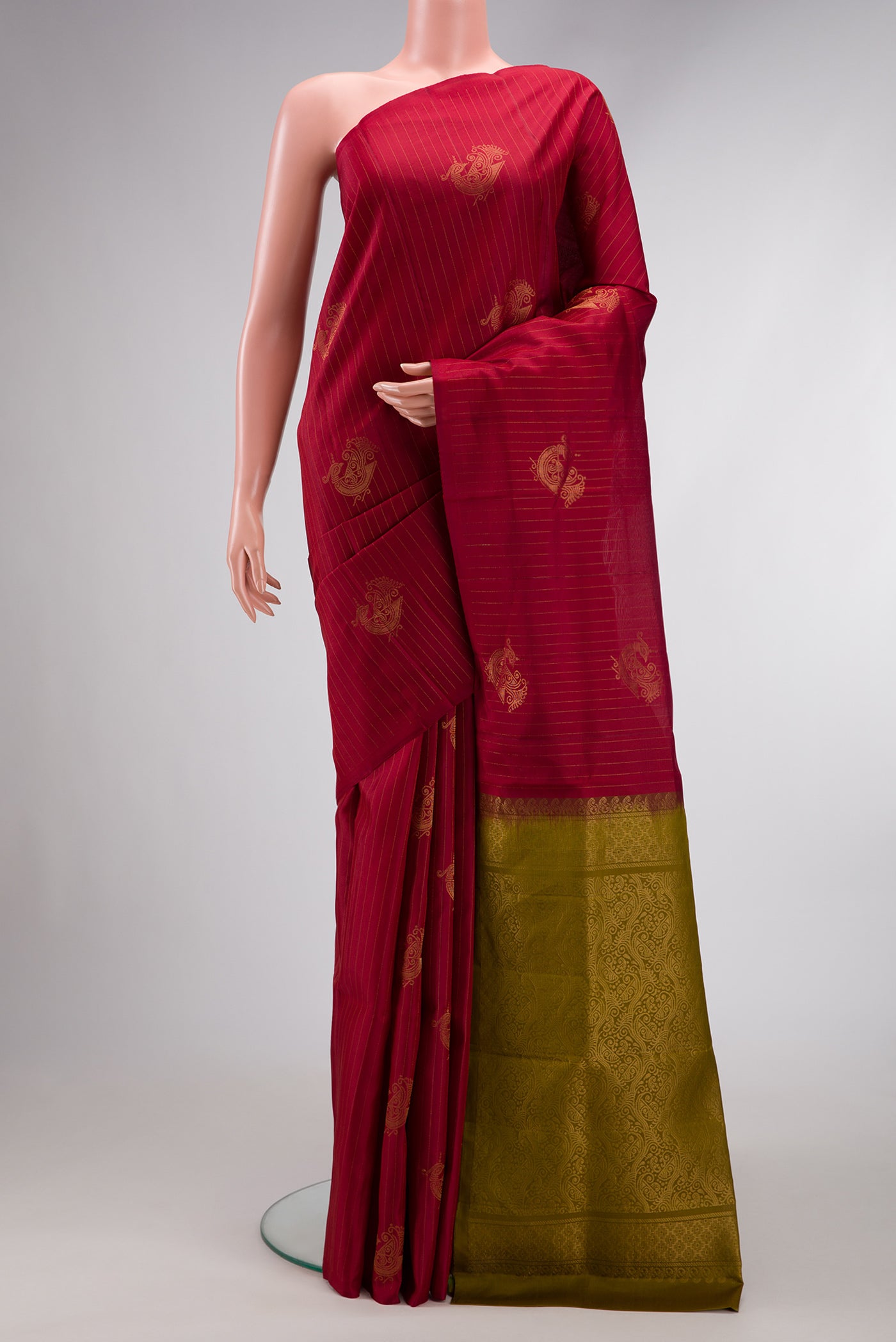 Maroon Dual Tone Soft Silk Saree with Zari Butta on the body and Without Border.  displayed on a mannequin