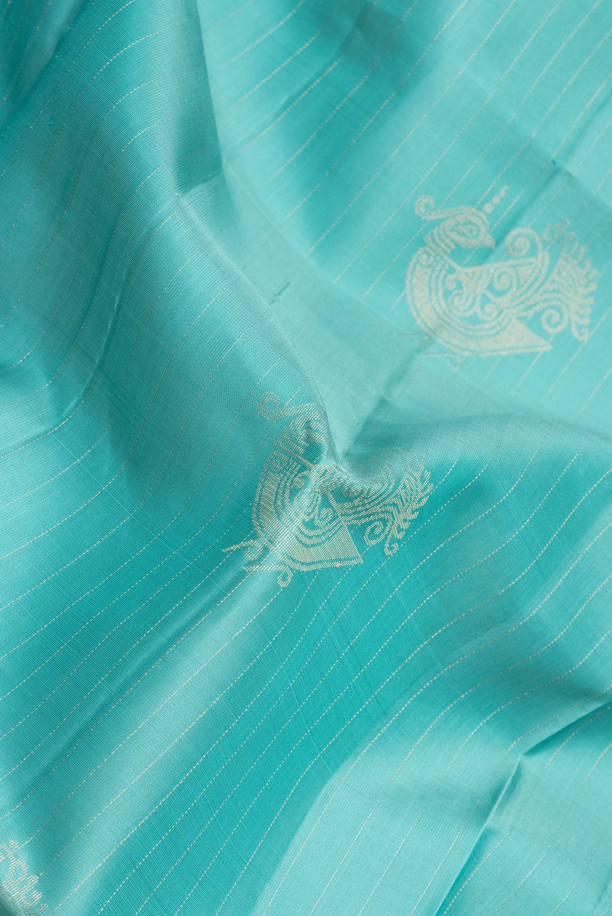 Close up of Sea Green Dual Tone Soft Silk Saree with Stripes on the body and Without Border.  displaying folds