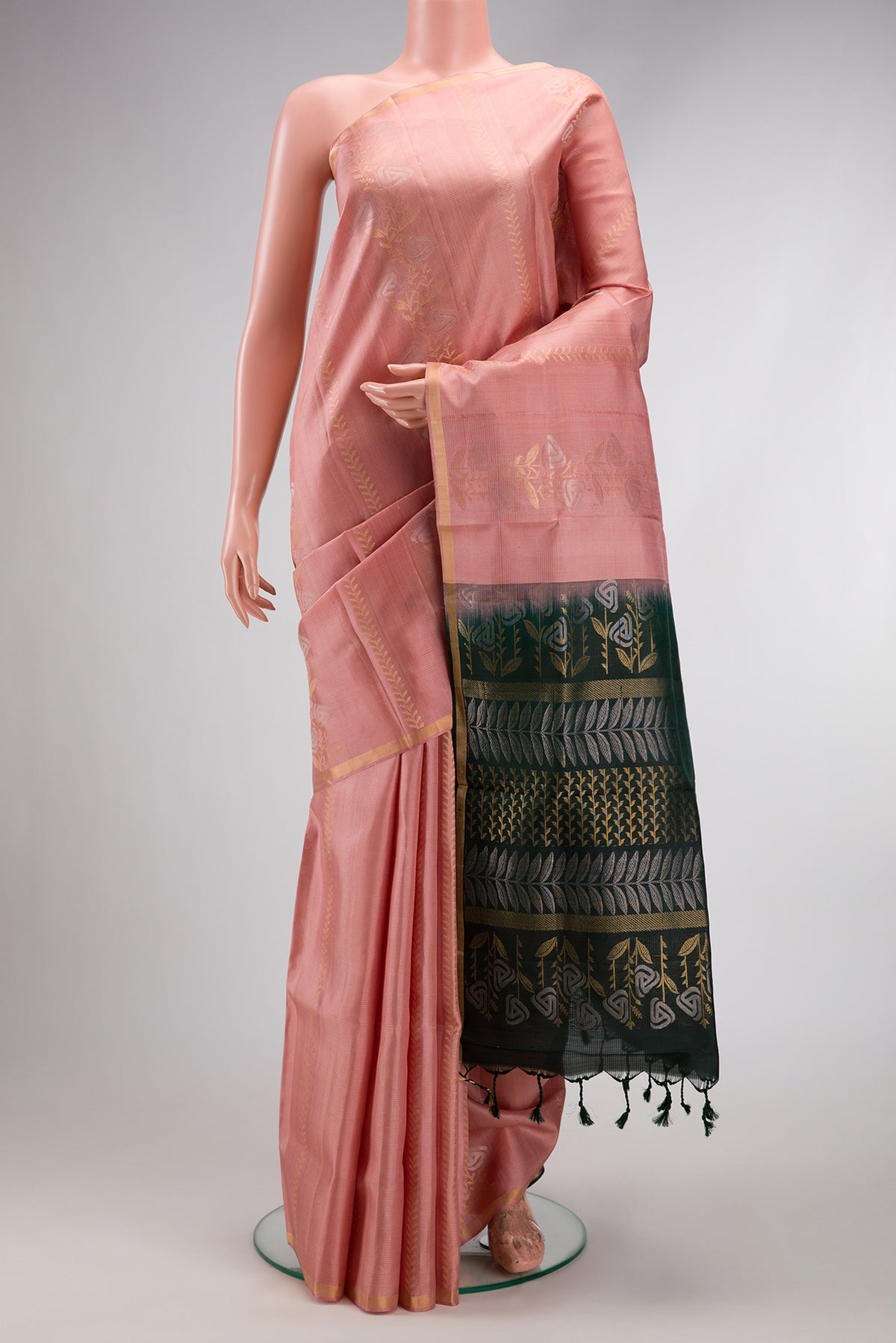 Golden Peach Dual Tone Soft Silk Saree with Zari Butta on the body and Zari Border.  displayed on a mannequin