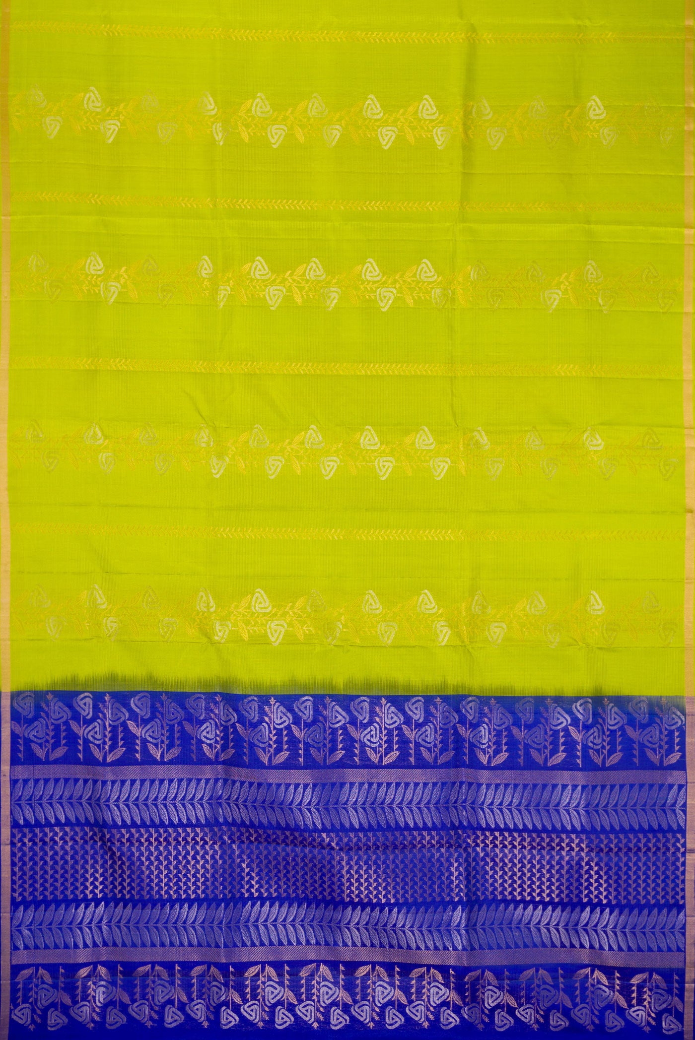 Flat view of Parrot Green Dual Tone Soft Silk Saree with Zari Butta on the body and Zari Border. 