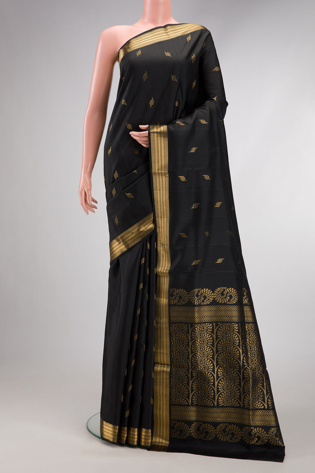 Black Dual Tone Soft Silk Saree with Zari Butta on the body and Zari Border.  displayed on a mannequin