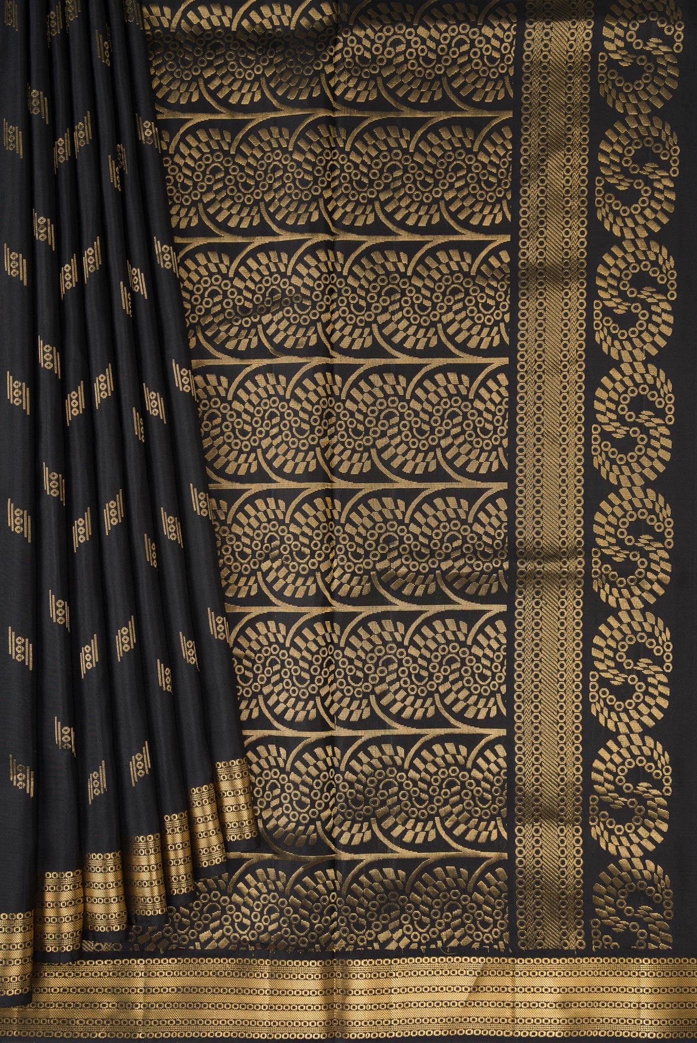 Pleats and pallu of Black Dual Tone Soft Silk Saree with Zari Butta on the body and Zari Border. 