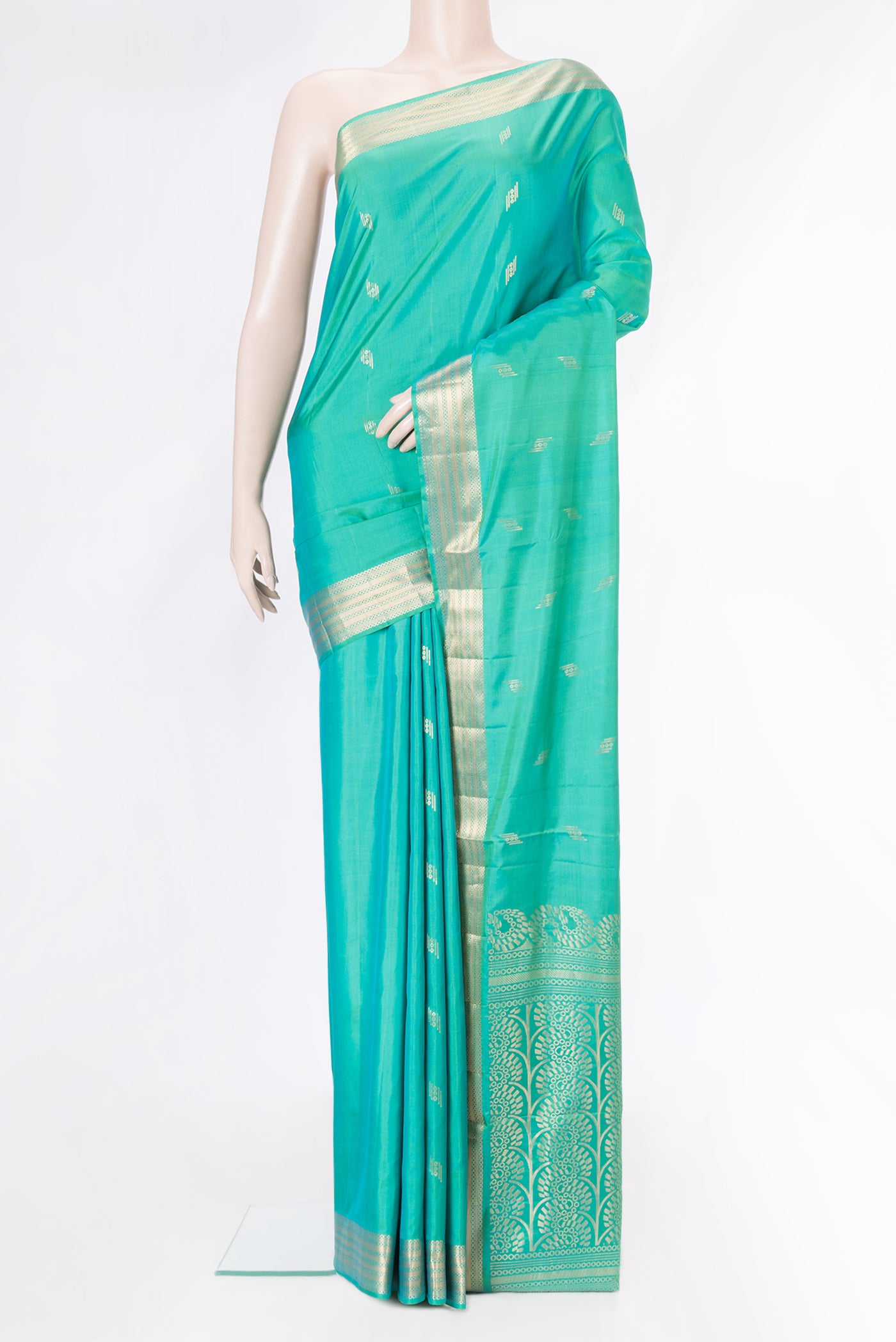 Sea Green Dual Tone Soft Silk Saree with Zari Butta on the body and Zari Border.  displayed on a mannequin
