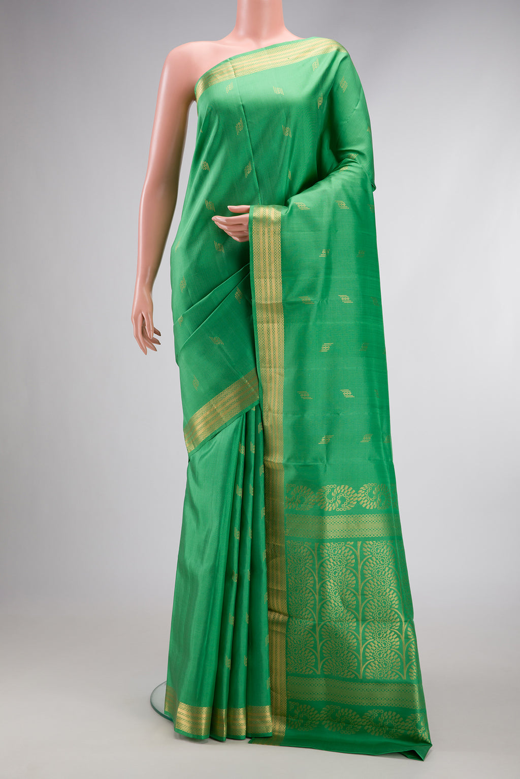 Pista Green Dual Tone Soft Silk Saree with Zari Butta on the body and Zari Border.  displayed on a mannequin