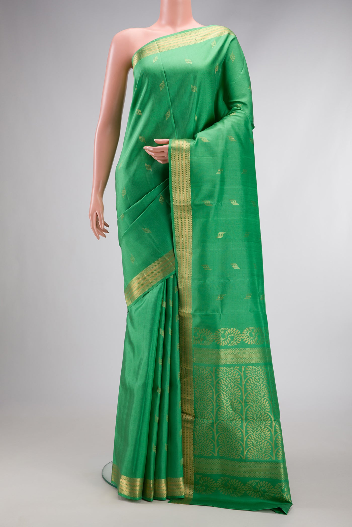 Pista Green Dual Tone Soft Silk Saree with Zari Butta on the body and Zari Border.  displayed on a mannequin