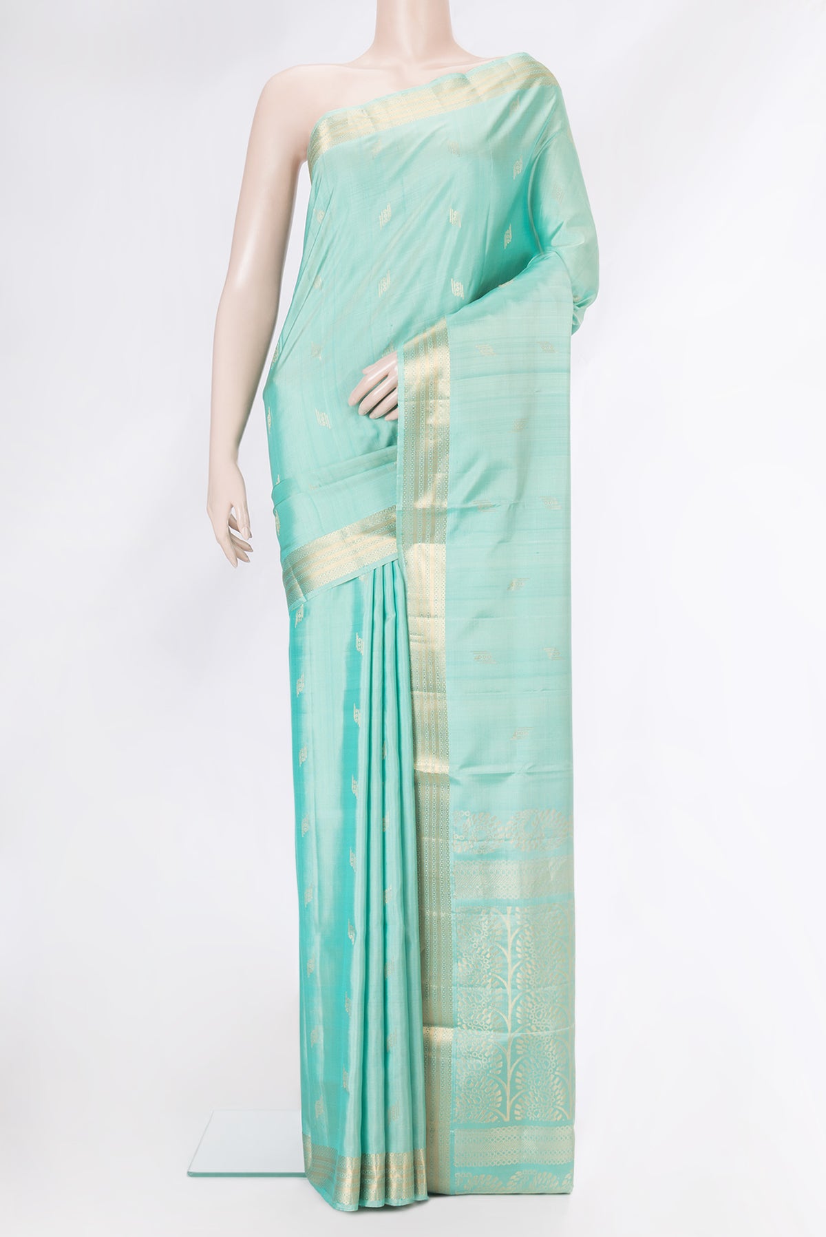 Sky Blue Soft Silk Saree with Zari Butta on the body and Zari Border.  displayed on a mannequin
