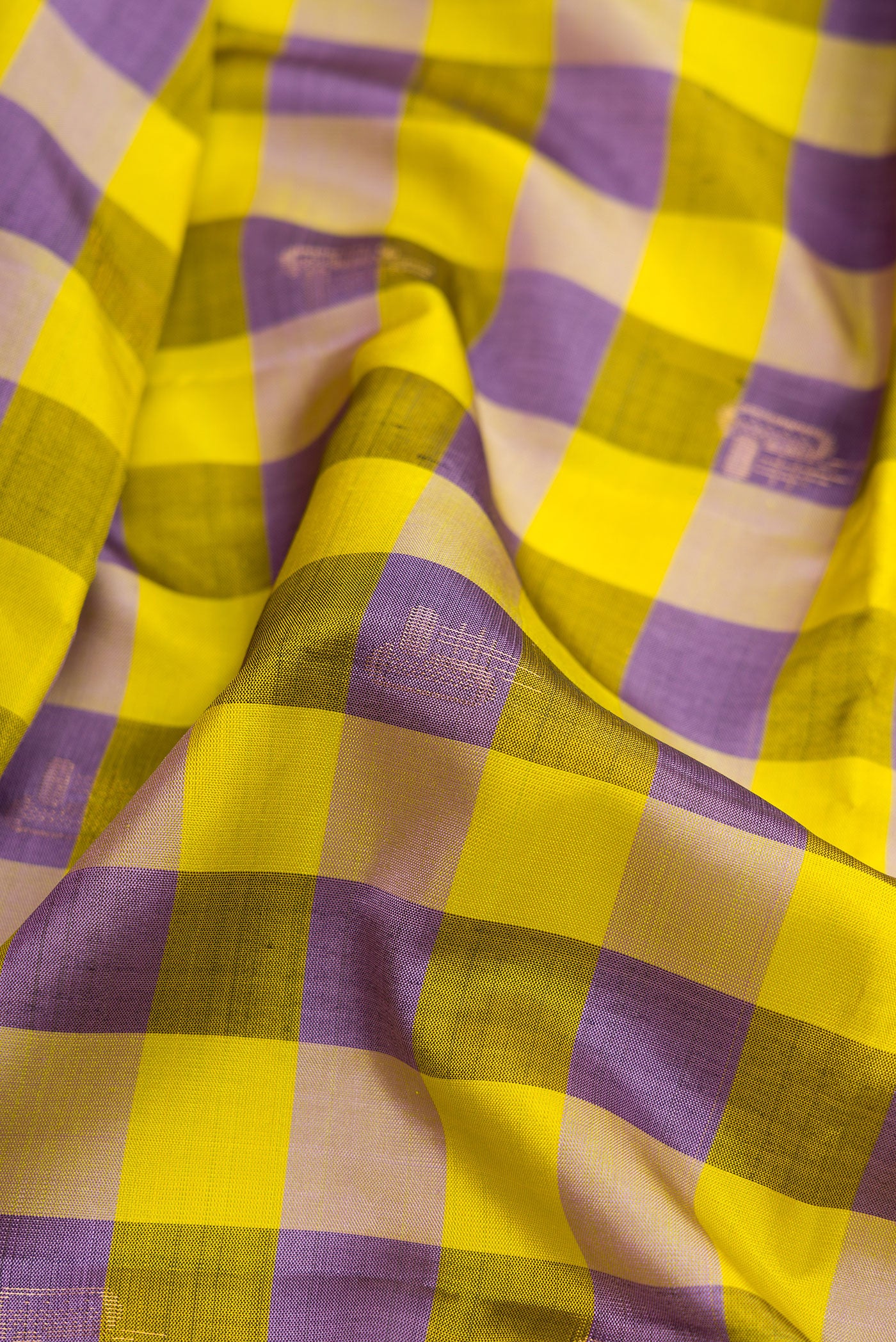 Close up of Parrot Green and Royal Blue Color Soft Silk Saree with Checked design on the body and Checks Border.  displaying folds