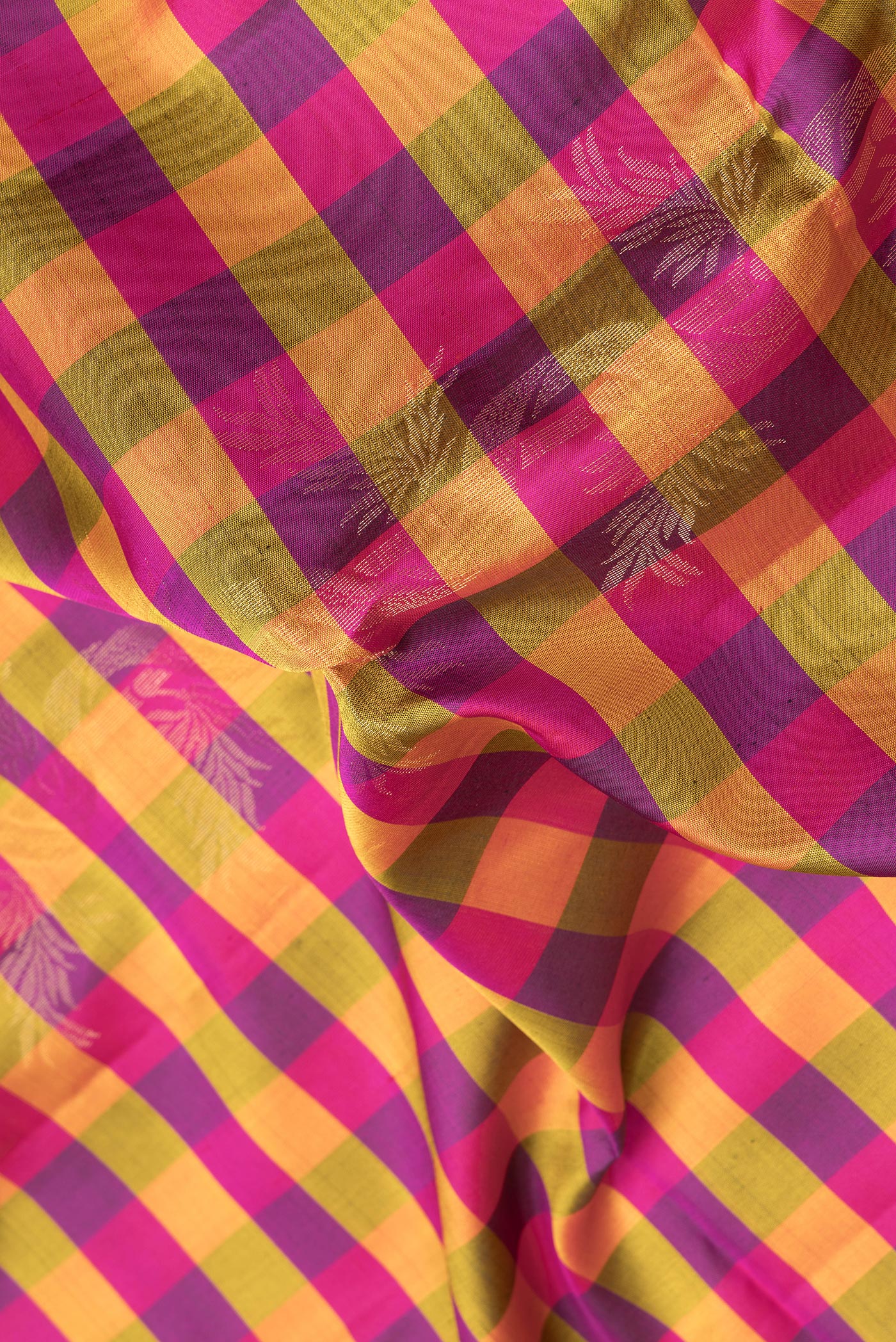 Close up of Multi Color Soft Silk Saree with Checked design on the body and Zari Border.  displaying folds