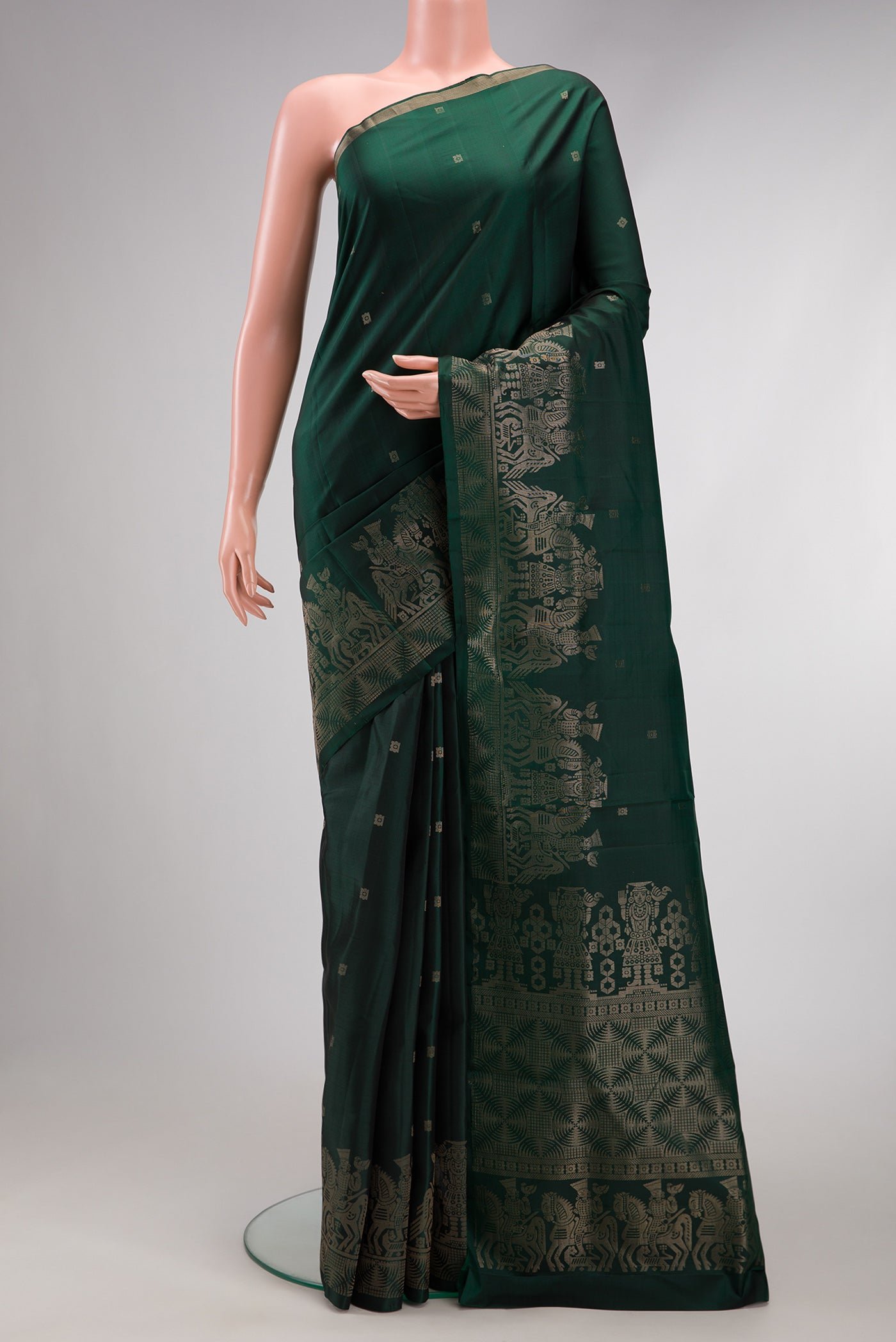 Bottle Green Dual Tone Soft Silk Saree with Zari Butta on the body and Fancy Border.  displayed on a mannequin