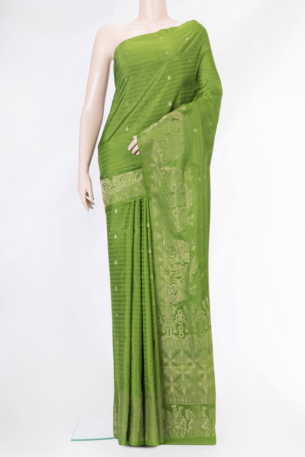 Green Soft Silk Saree with Zari Butta on the body and Fancy Border.  displayed on a mannequin