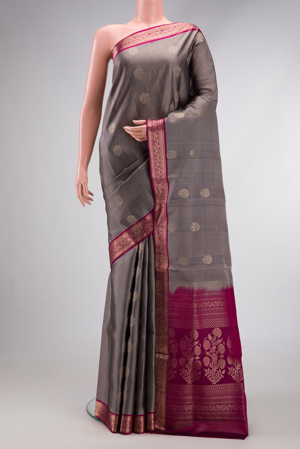 Grey Dual Tone Soft Silk Saree with Zari Butta on the body and Zari Border.  displayed on a mannequin