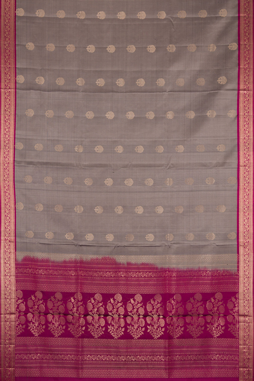 Flat view of Grey Dual Tone Soft Silk Saree with Zari Butta on the body and Zari Border. 