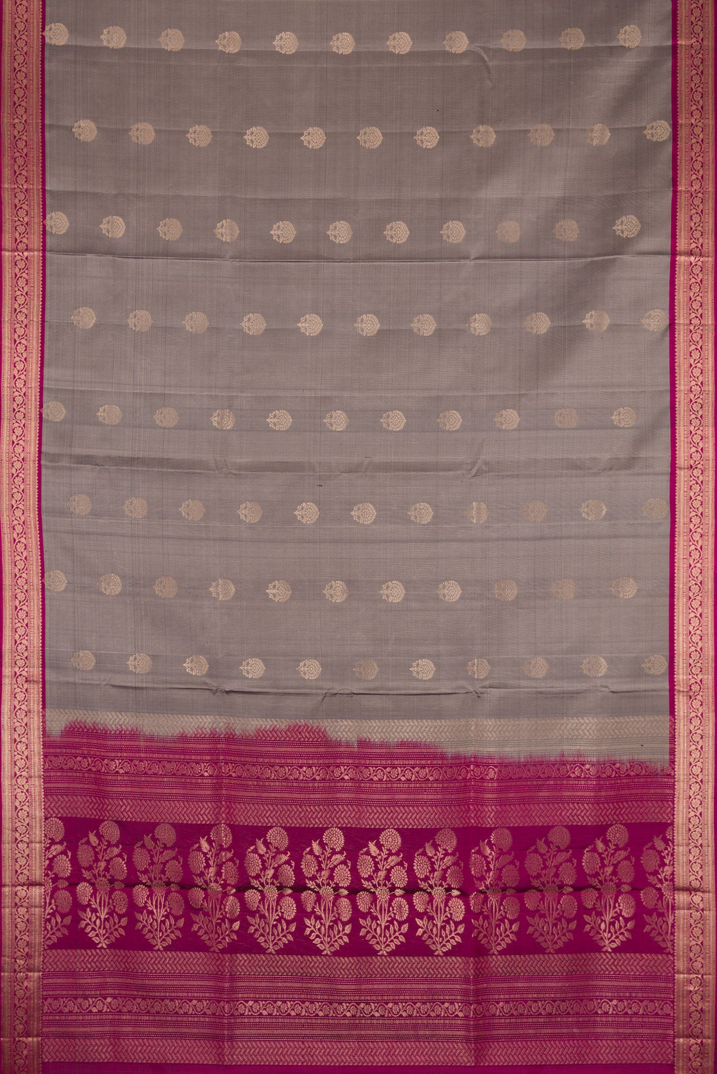 Flat view of Grey Dual Tone Soft Silk Saree with Zari Butta on the body and Zari Border. 