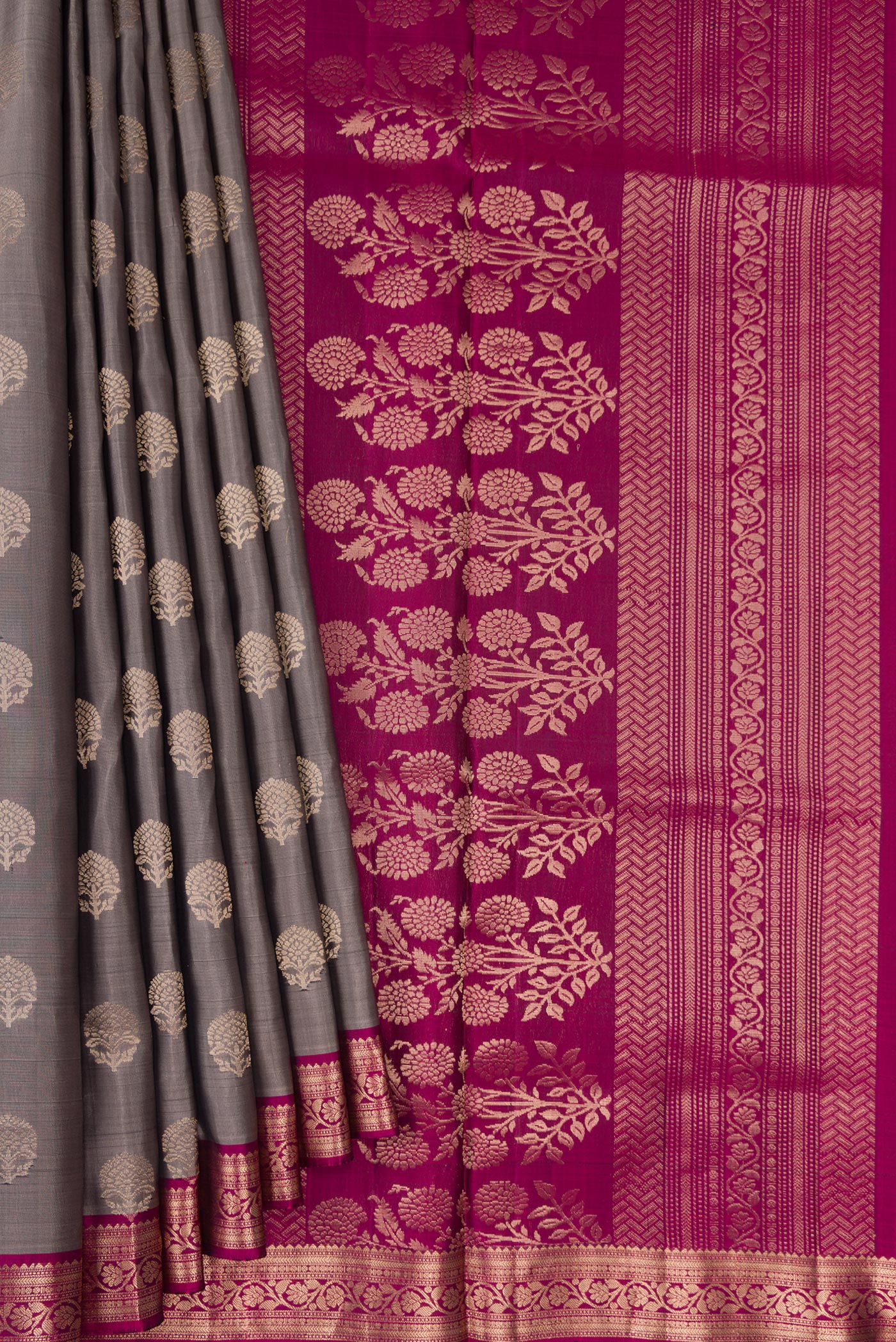 Pleats and pallu of Grey Dual Tone Soft Silk Saree with Zari Butta on the body and Zari Border. 