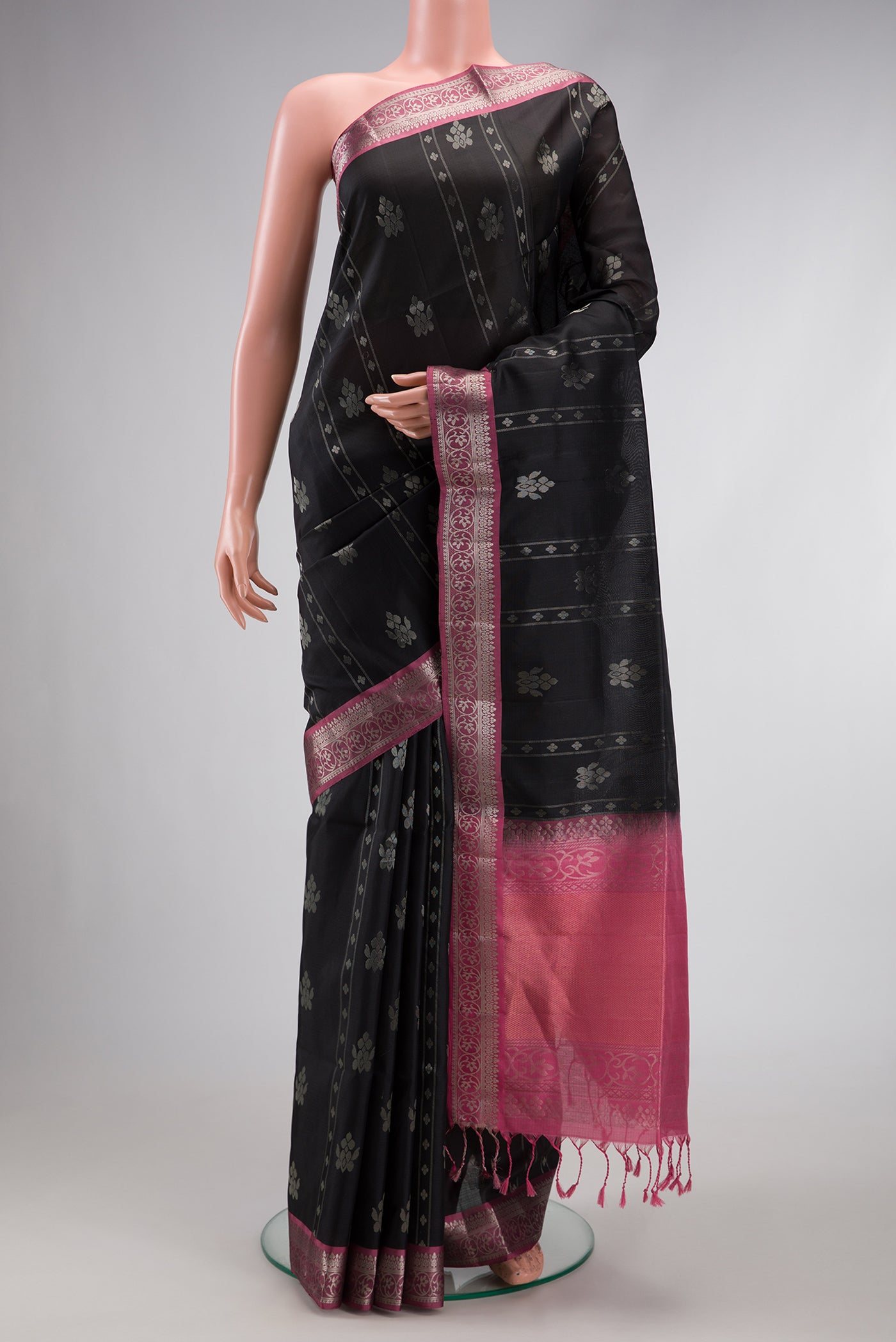 Black Dual Tone Soft Silk Saree with Zari Butta on the body and Zari Border.  displayed on a mannequin