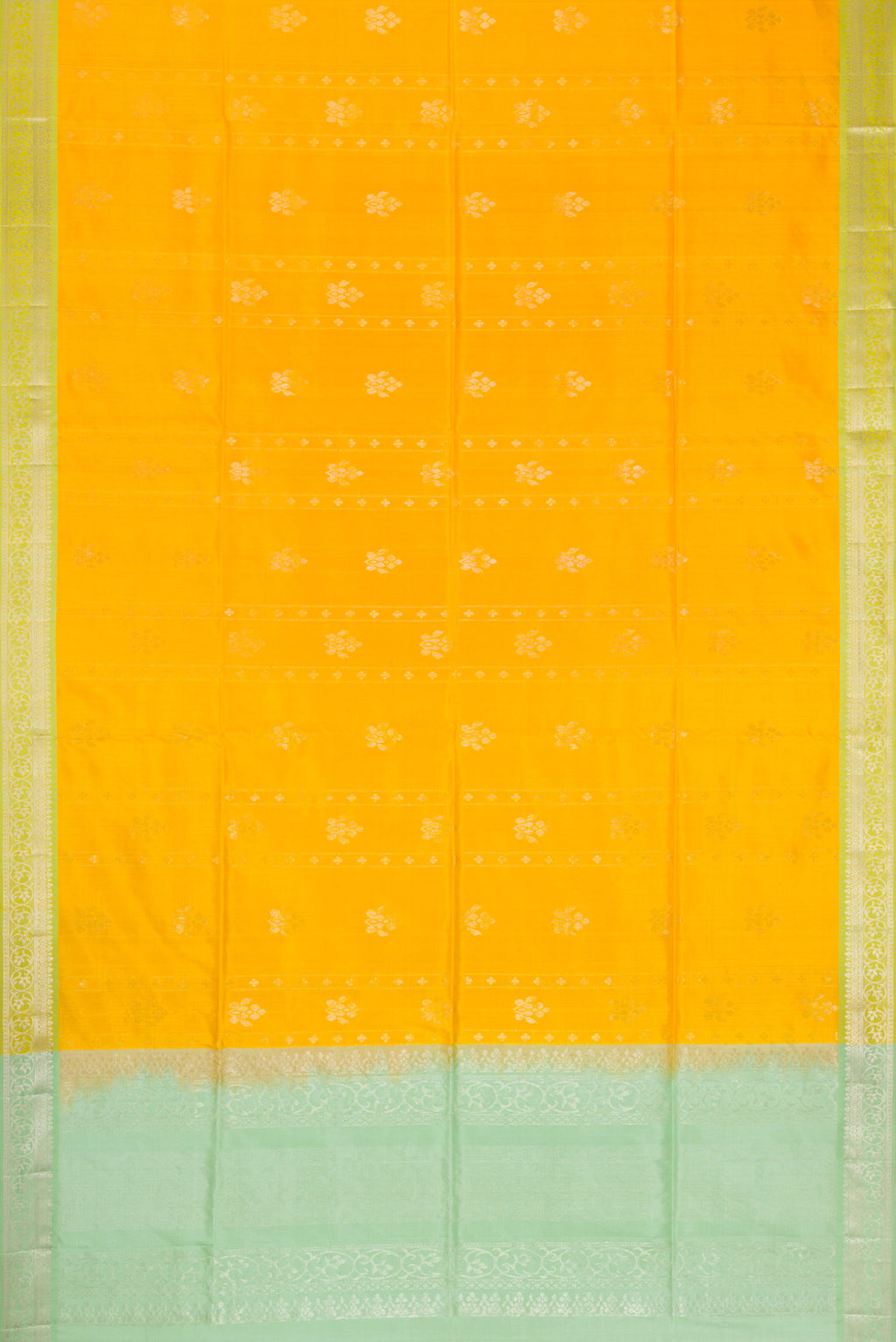 Flat view of Yellow Dual Tone Soft Silk Saree with Zari Butta on the body and Zari Border. 