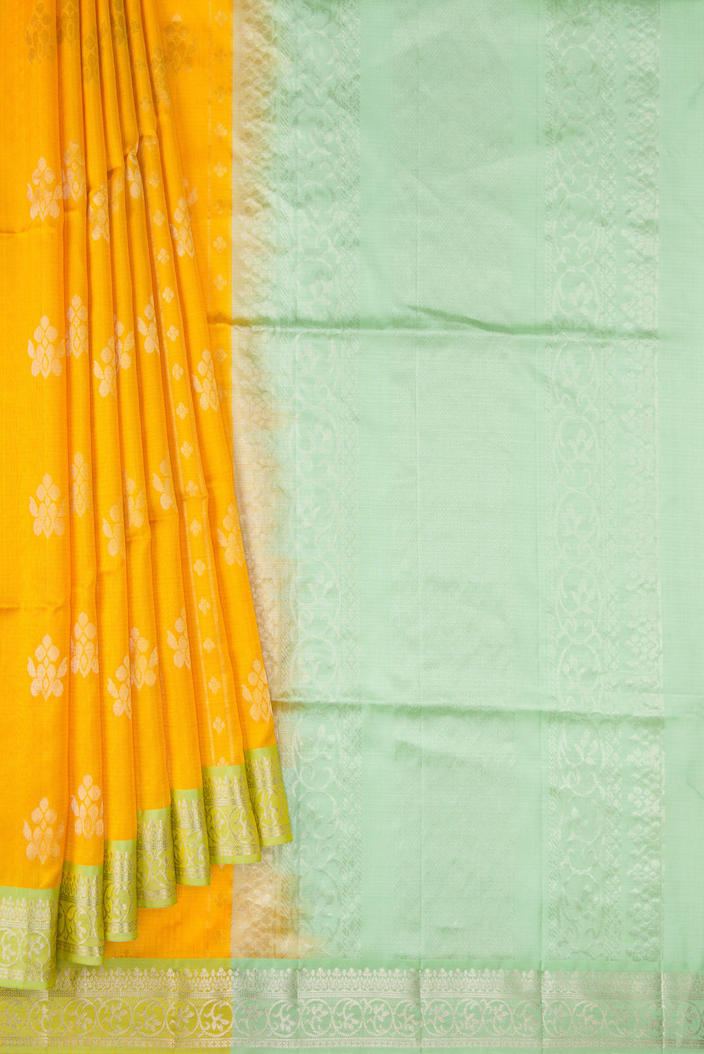 Pleats and pallu of Yellow Dual Tone Soft Silk Saree with Zari Butta on the body and Zari Border. 