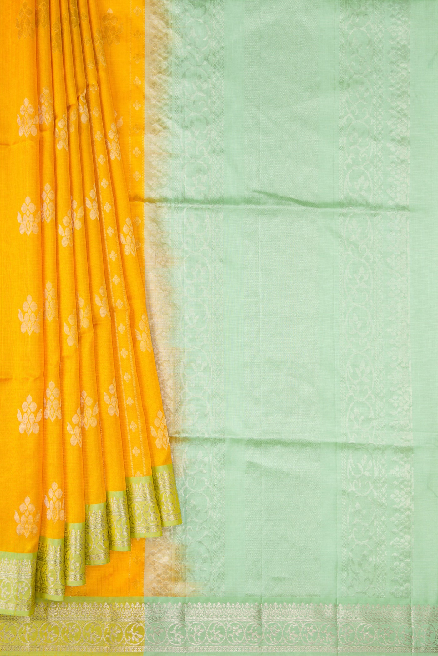 Pleats and pallu of Yellow Dual Tone Soft Silk Saree with Zari Butta on the body and Zari Border. 
