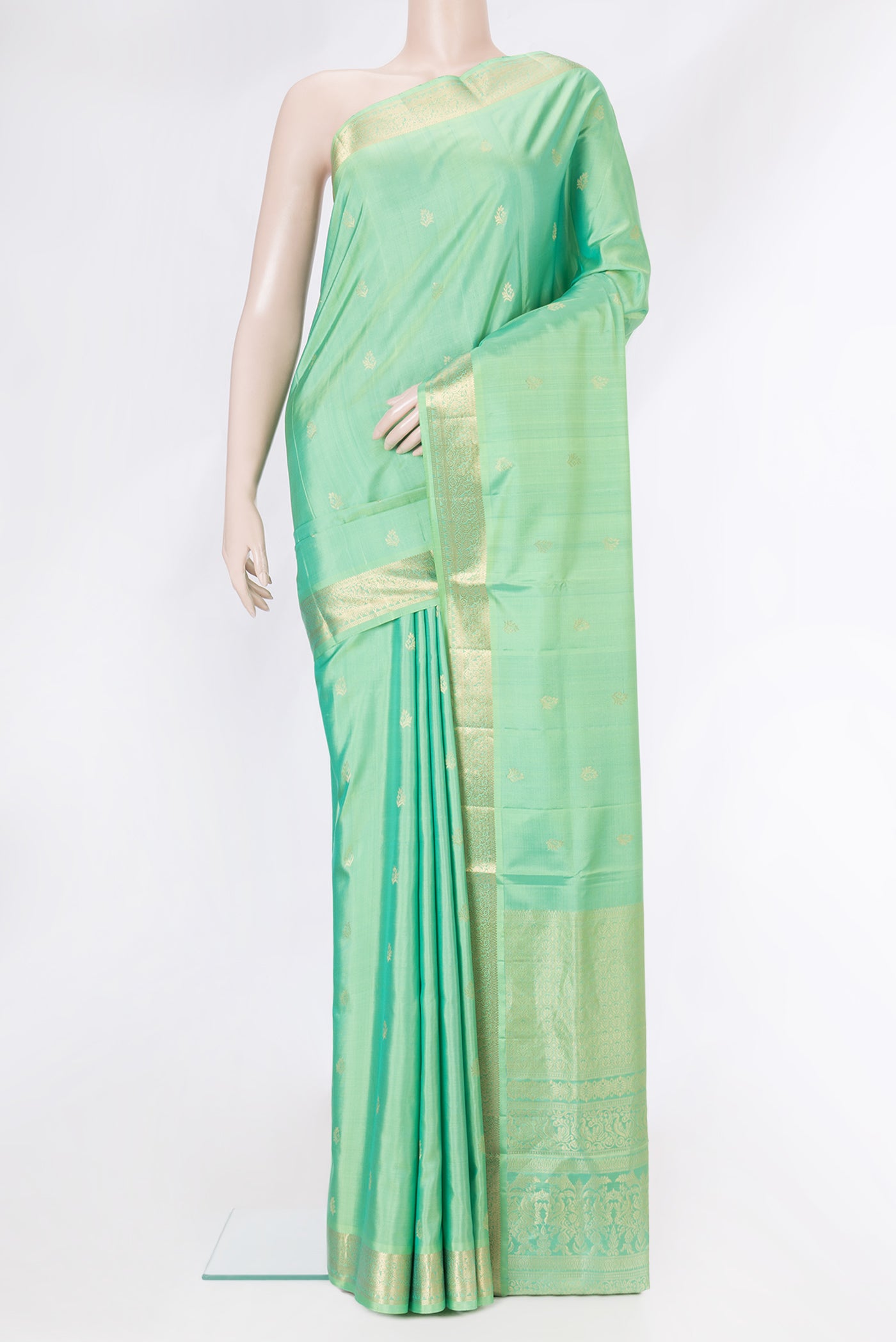 Sea Green Dual Tone Soft Silk Saree with Zari Butta on the body and Zari Border.  displayed on a mannequin
