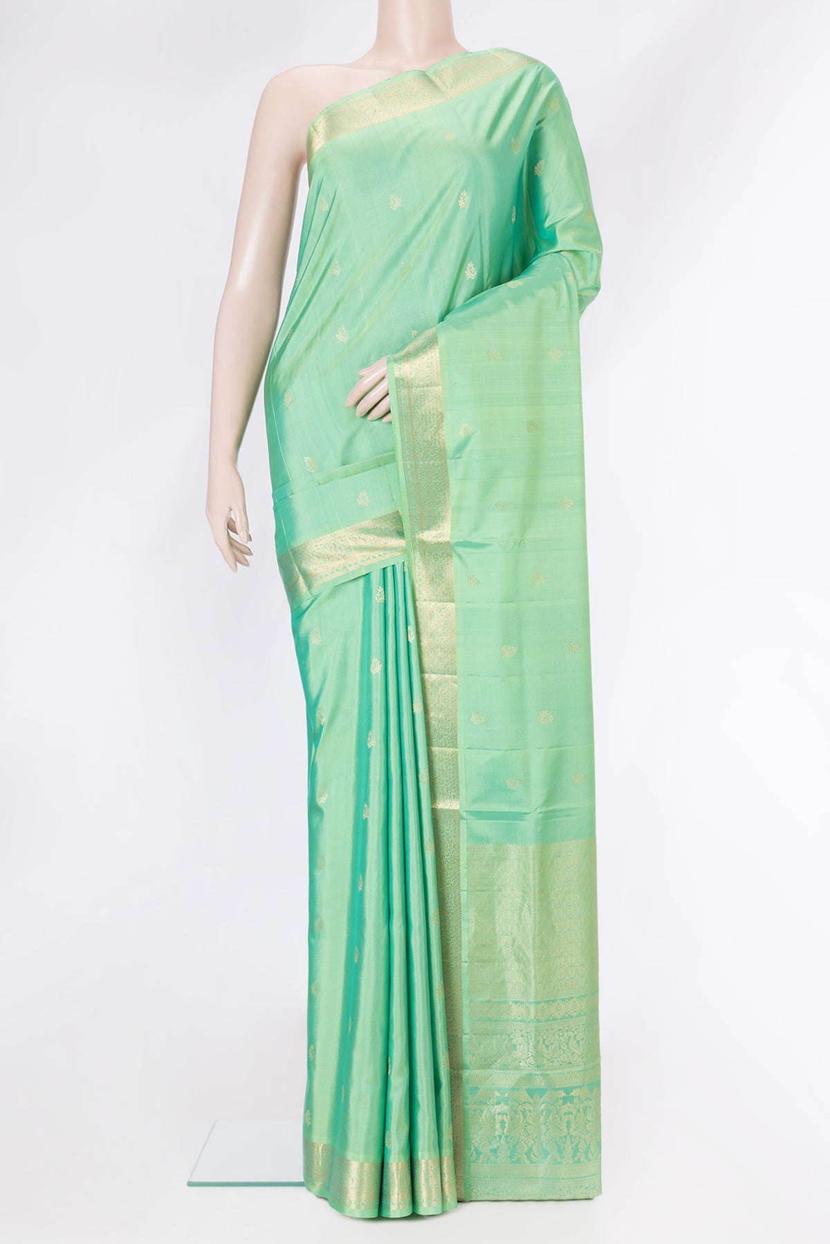 Sea Green Dual Tone Soft Silk Saree with Zari Butta on the body and Zari Border.  displayed on a mannequin