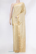 Beige Soft Silk Saree with Zari Butta on the body and Zari Border.  displayed on a mannequin