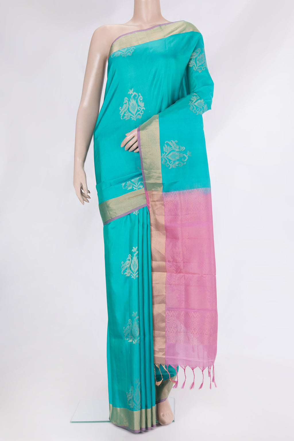 Sky Blue Soft Silk Saree with Zari Butta on the body and Zari Border.  displayed on a mannequin