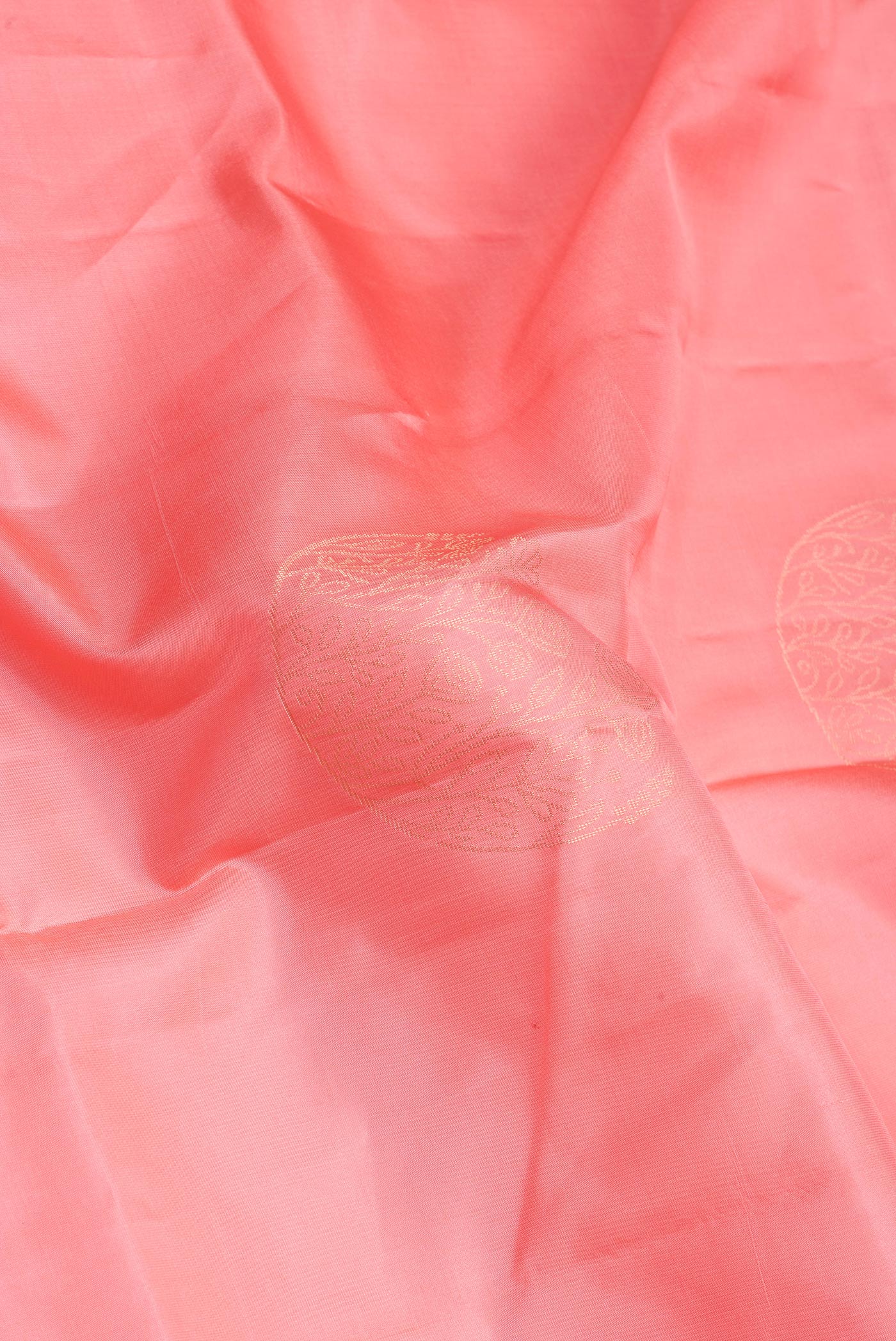 Close up of Pink Soft Silk Saree with Zari Butta on the body and Fancy Border.  displaying folds