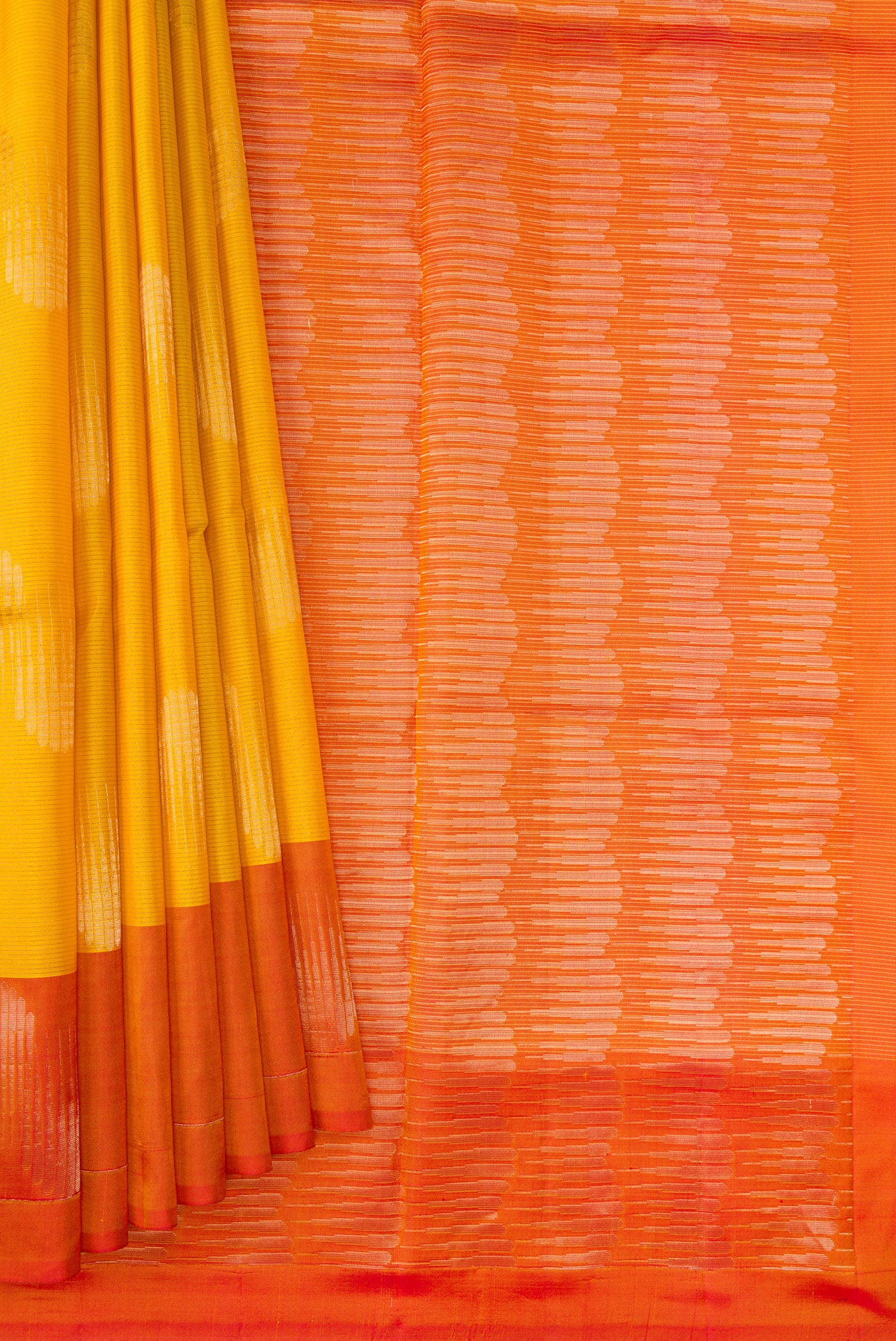 Pleats and pallu of Yellow Soft Silk Saree with Stripes on the body and Zari Border. 