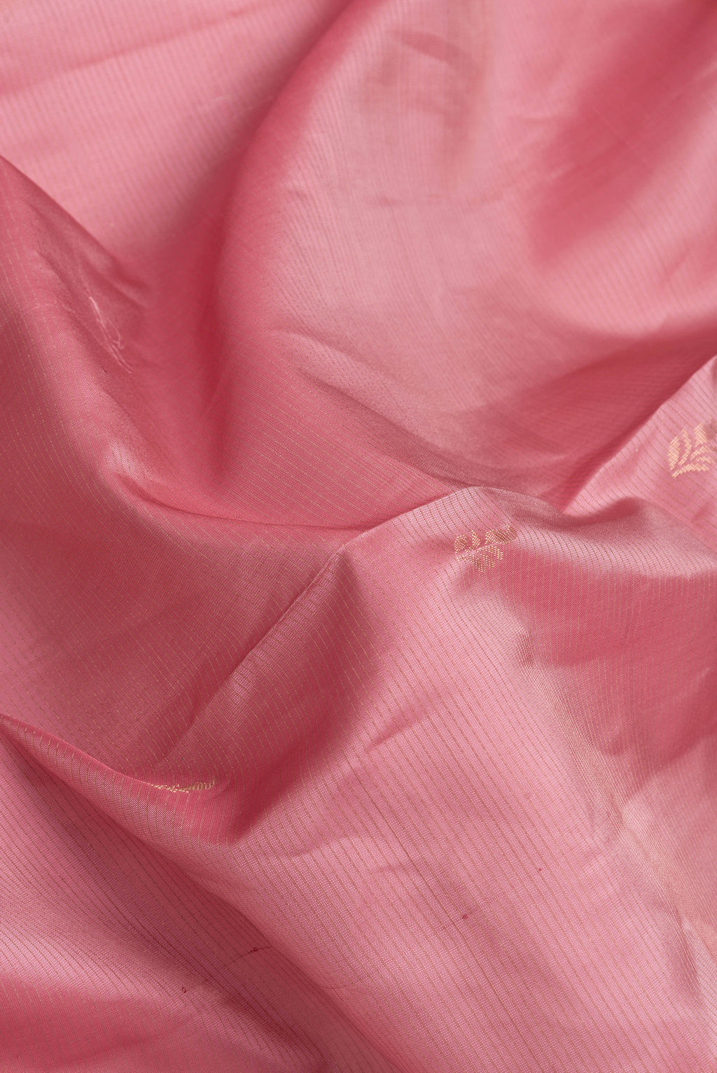 Close up of Pink Dual Tone Soft Silk Saree with Stripes on the body and Fancy Border.  displaying folds