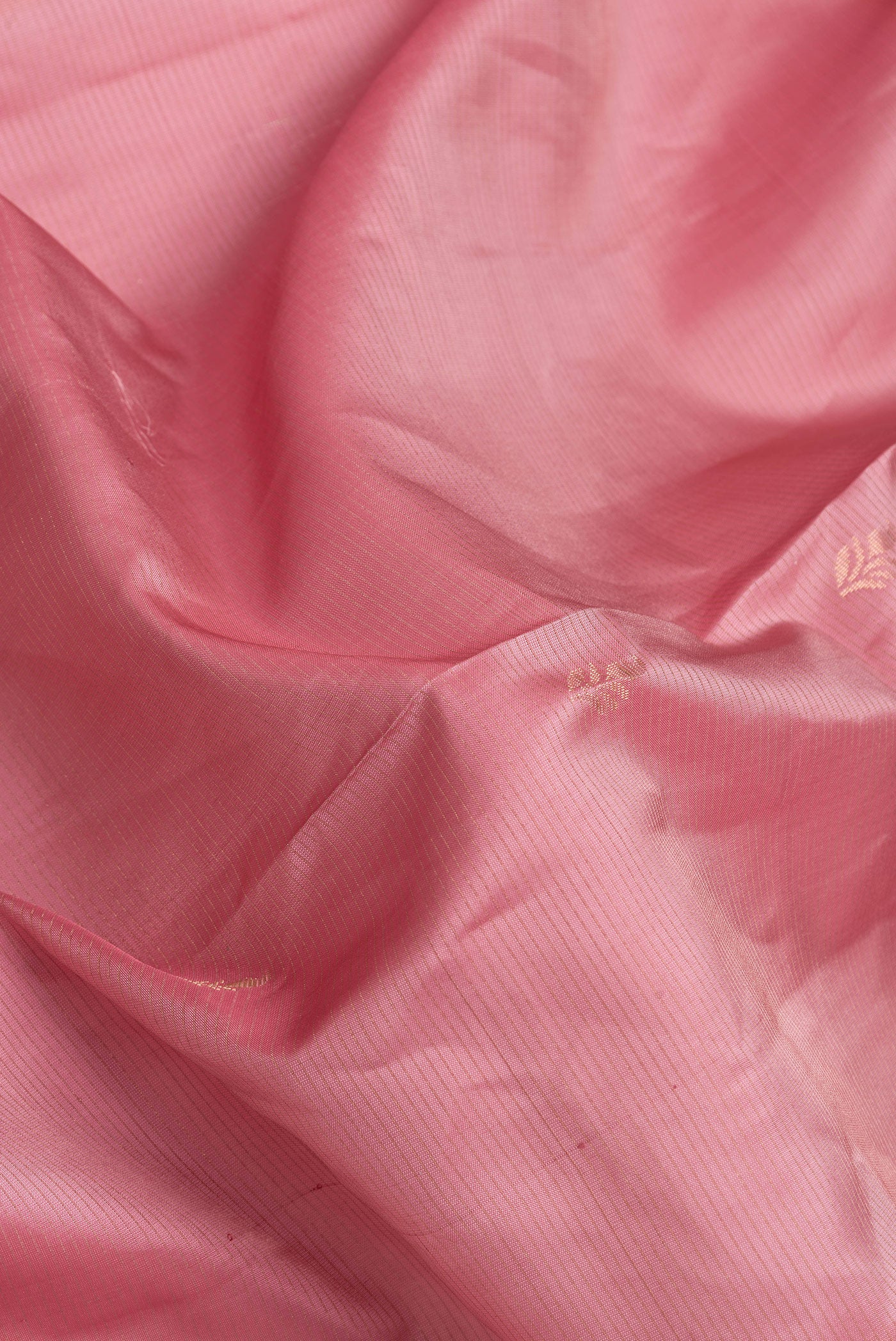 Close up of Pink Dual Tone Soft Silk Saree with Stripes on the body and Fancy Border.  displaying folds