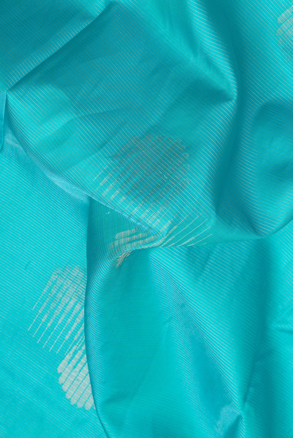 Close up of Sky Blue Dual Tone Soft Silk Saree with Stripes on the body and Fancy Border.  displaying folds