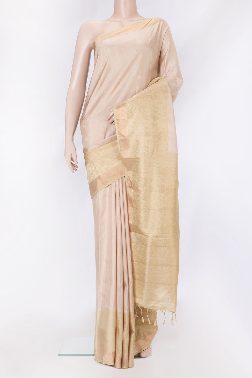 Beige Dual Tone Soft Silk Saree with Zari Butta on the body and Fancy Border.  displayed on a mannequin