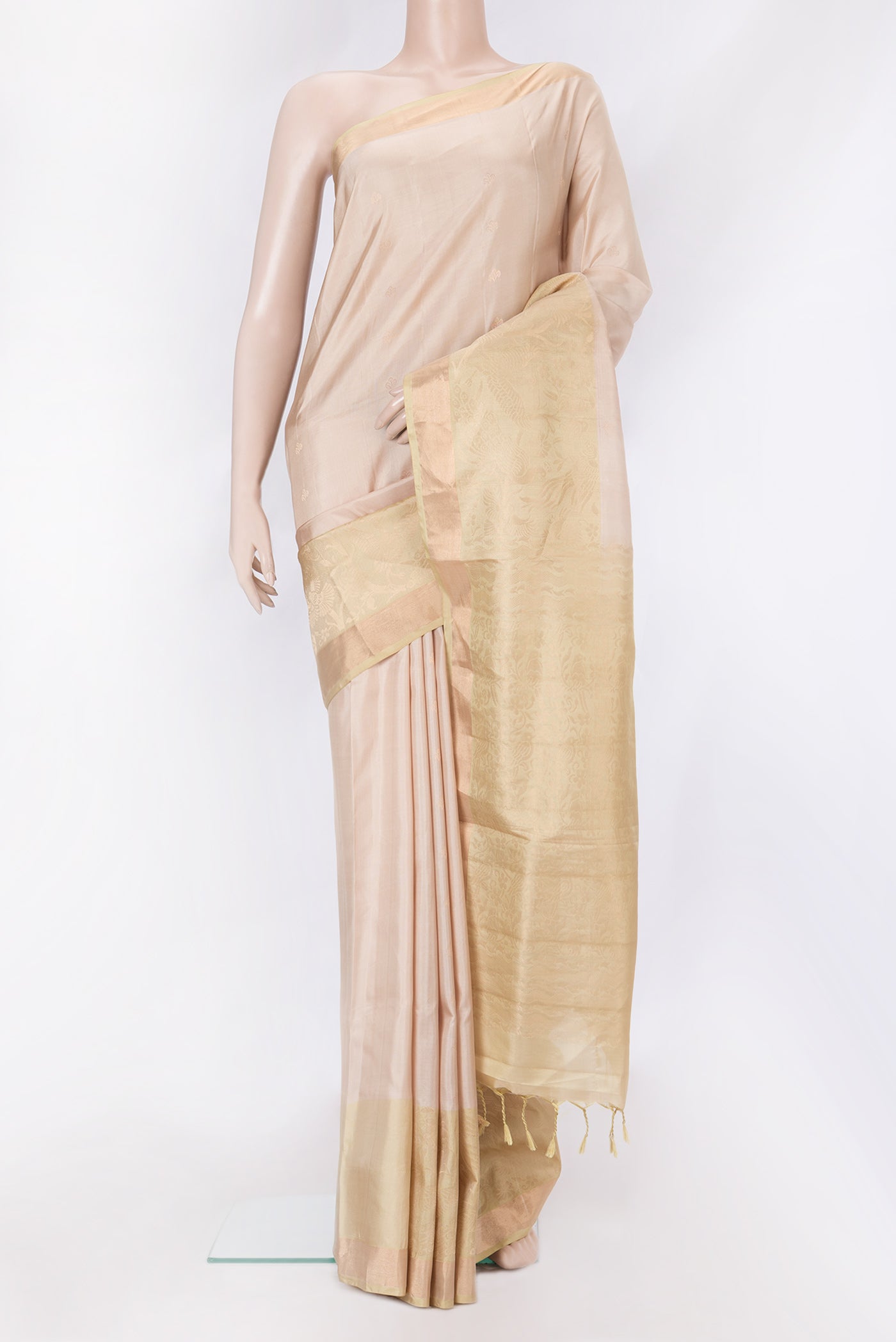 Beige Dual Tone Soft Silk Saree with Zari Butta on the body and Fancy Border.  displayed on a mannequin