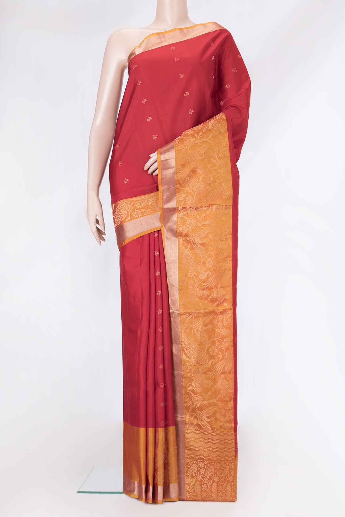 Maroon Dual Tone Soft Silk Saree with Zari Butta on the body and Fancy Border.  displayed on a mannequin
