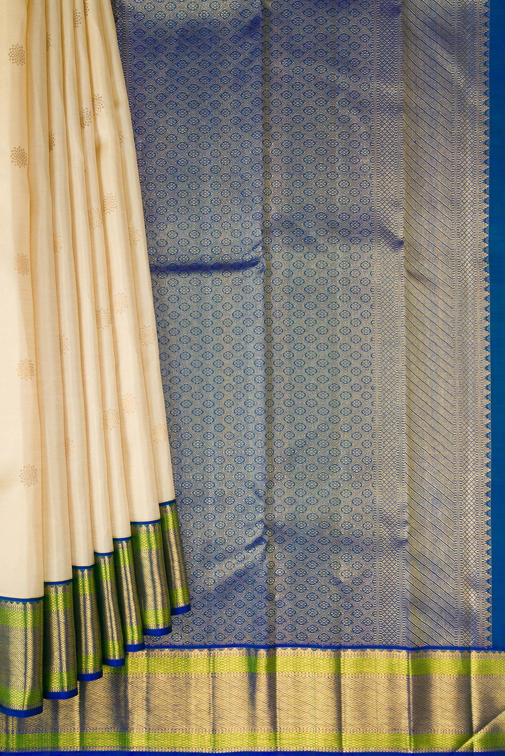 Pleats and pallu of Beige Dual Tone Kanchipuram Silk Saree with Zari Butta on the body and Zari Border. 