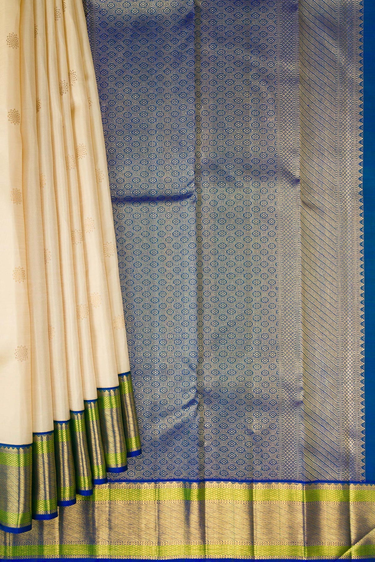 Pleats and pallu of Beige Dual Tone Kanchipuram Silk Saree with Zari Butta on the body and Zari Border. 