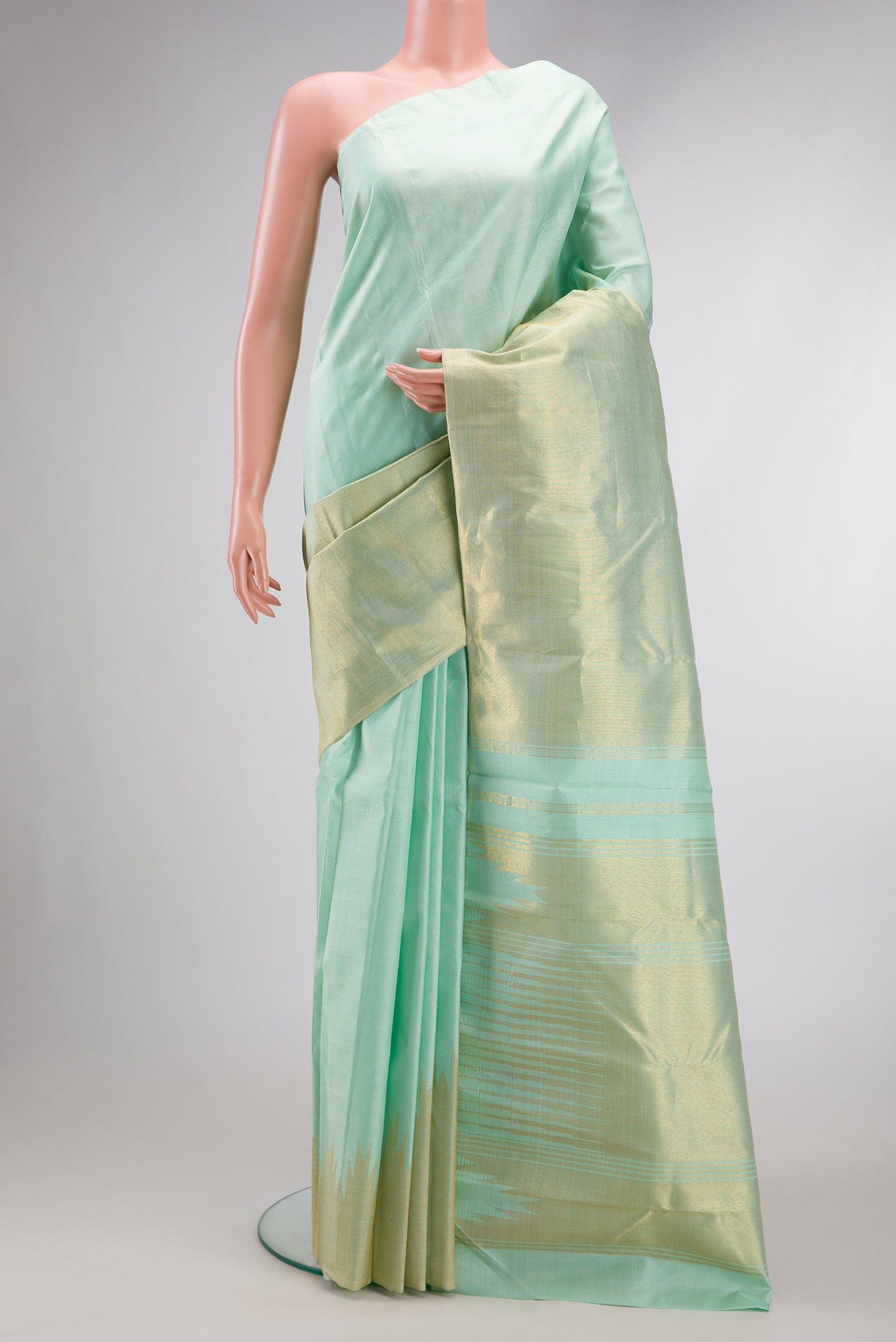 Light Blue Dual Tone Kanjivaram Silk Saree with Stripes on the body and Rising Temple Border.  displayed on a mannequin