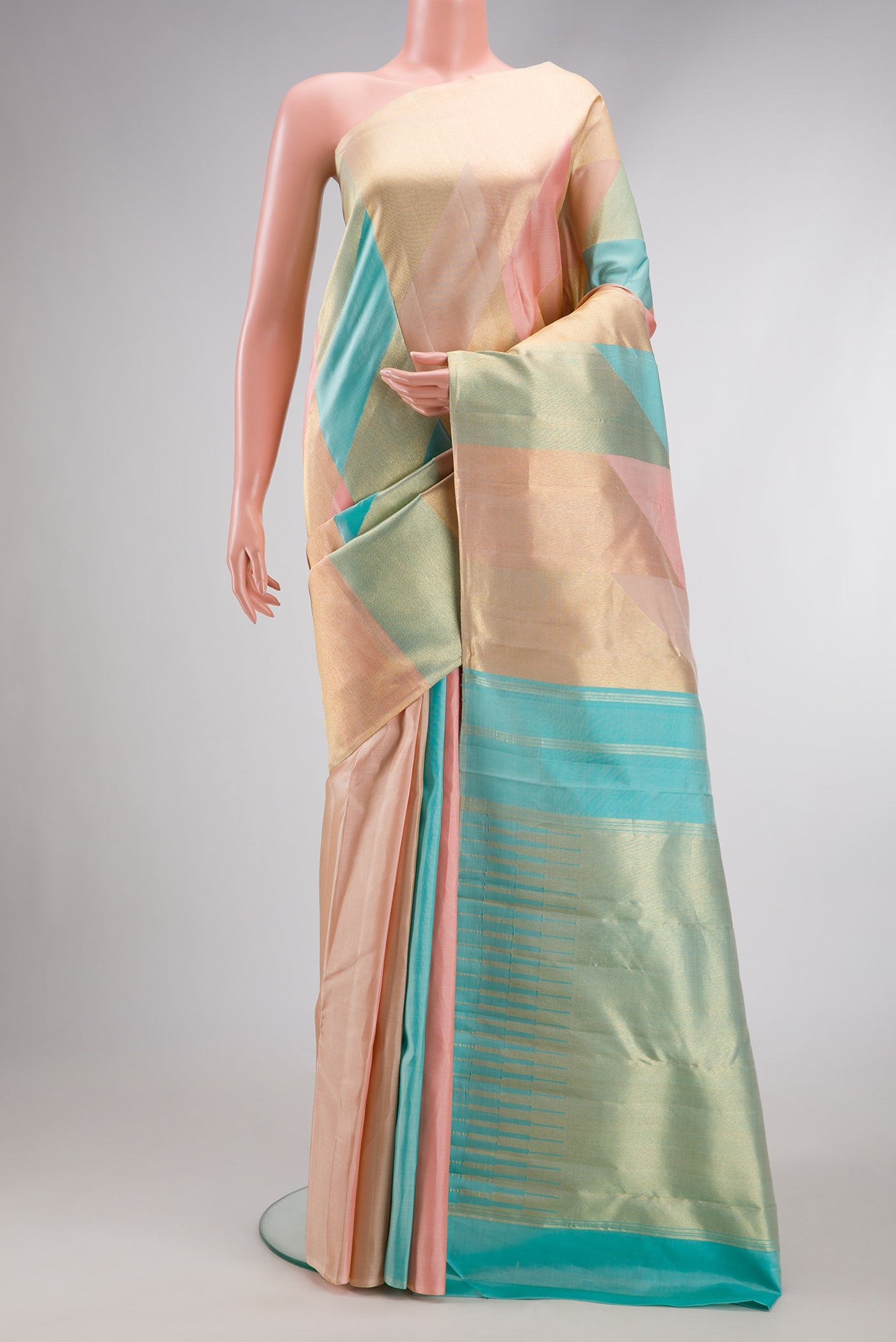 Peach Dual Tone Kanchipuram Silk Saree with Zari Brocade on the body and Fancy Border.  displayed on a mannequin