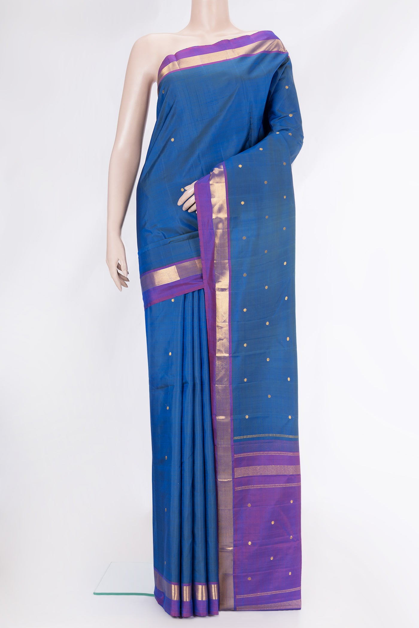 Peacock Blue Dual Tone Kanjivaram Silk Saree with Zari Butta on the body and Zari Border.  displayed on a mannequin