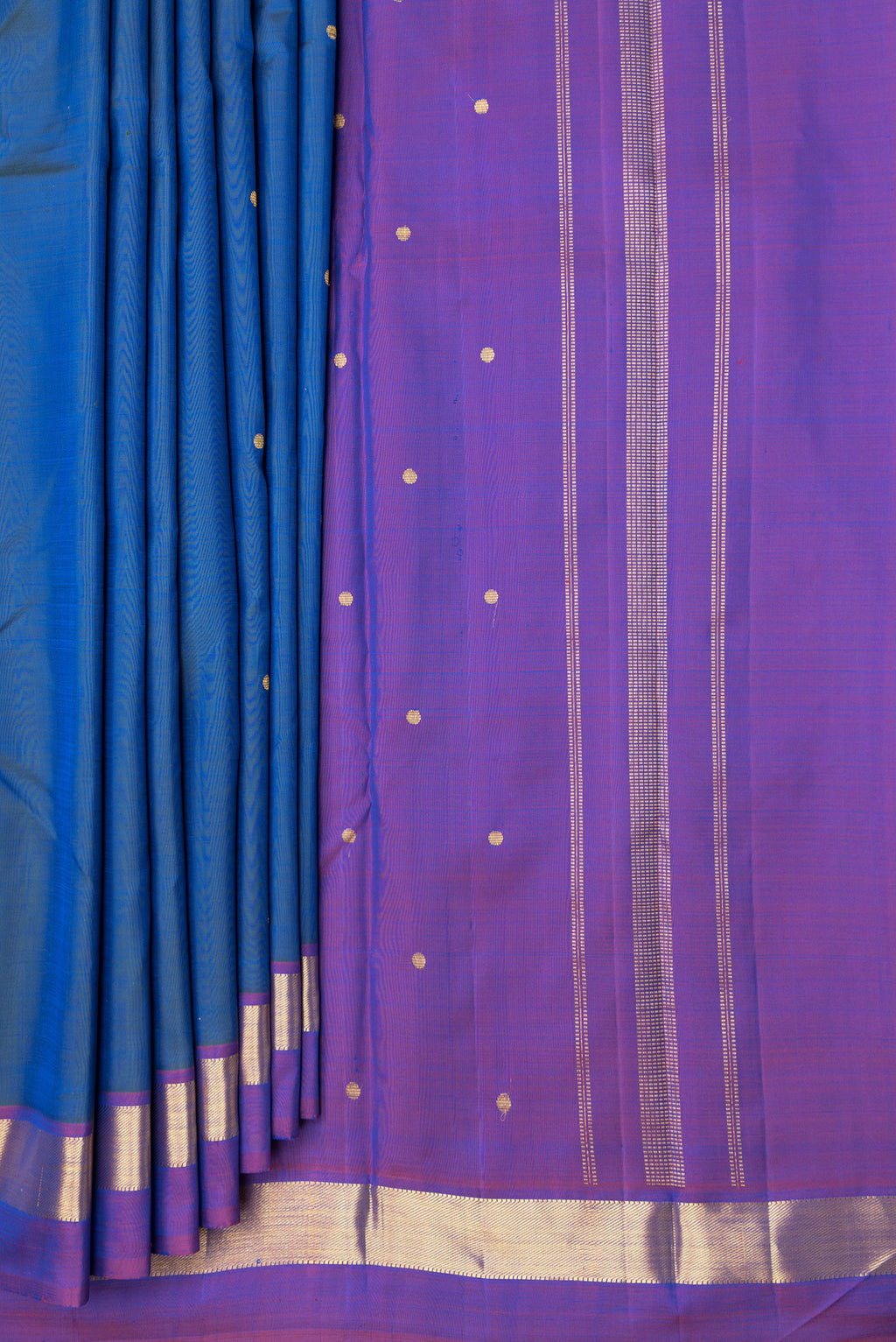 Pleats and pallu of Peacock Blue Dual Tone Kanjivaram Silk Saree with Zari Butta on the body and Zari Border. 