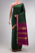 Bottle Green Dual Tone Kanchipuram Silk Saree with Stripes on the body and Zari Border.  displayed on a mannequin