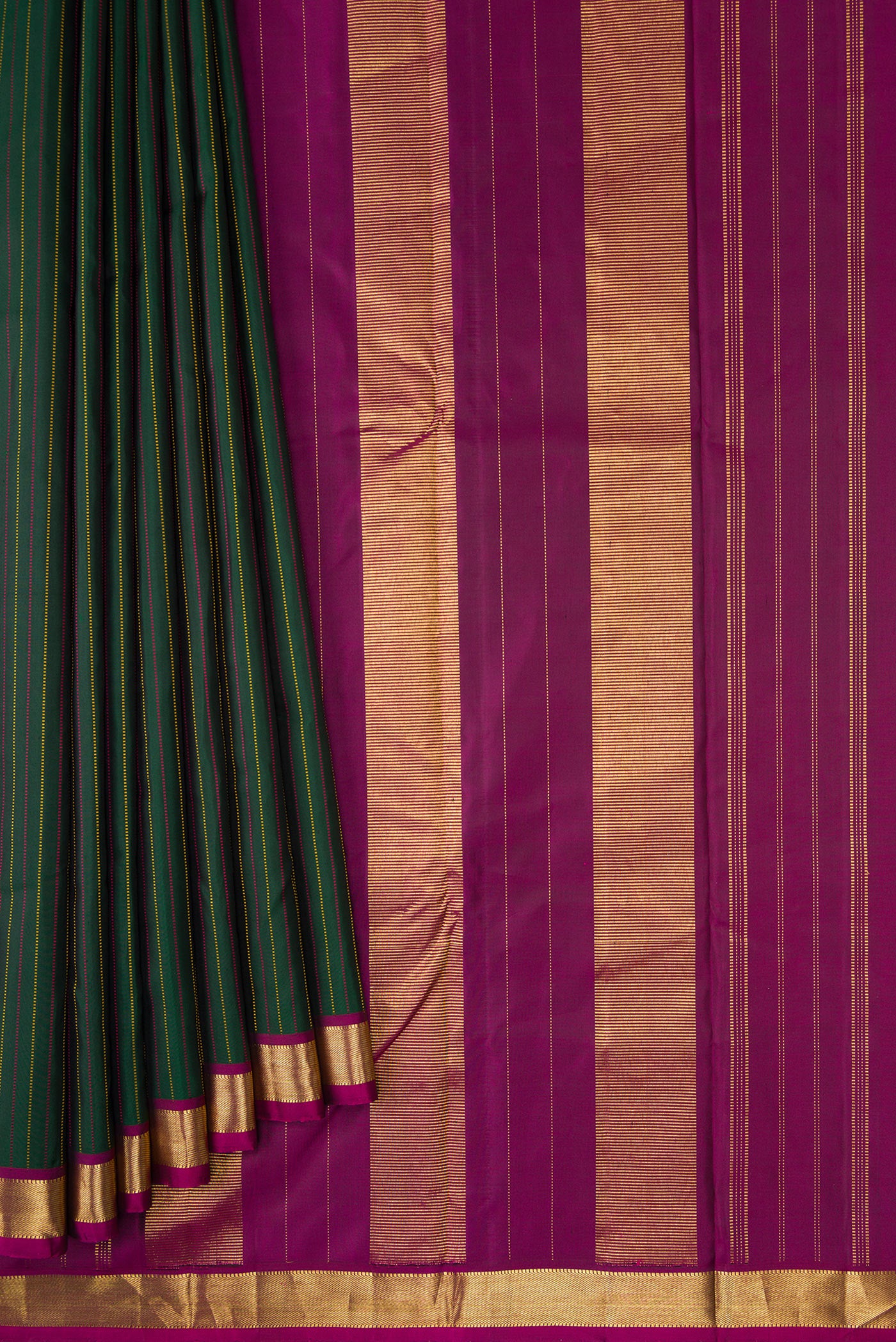 Pleats and pallu of Bottle Green Dual Tone Kanchipuram Silk Saree with Stripes on the body and Zari Border. 